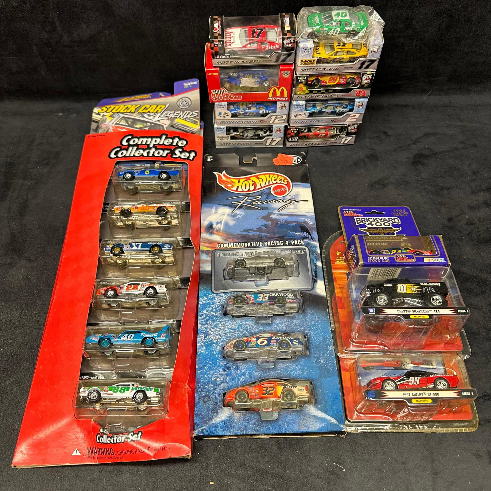 Large Lot of NASCAR Die-Cast Cars Hot Wheels Racing Champions Pit Shop and Legends Set: Mixed lot of NASCAR-themed die-cast collectibles, including Hot Wheels Racing Commemorative 4-Pack, Stock Car Legends Complete Collector Set, Brickyard 400 1994 Inaugural Race car, multiple Matt Kense