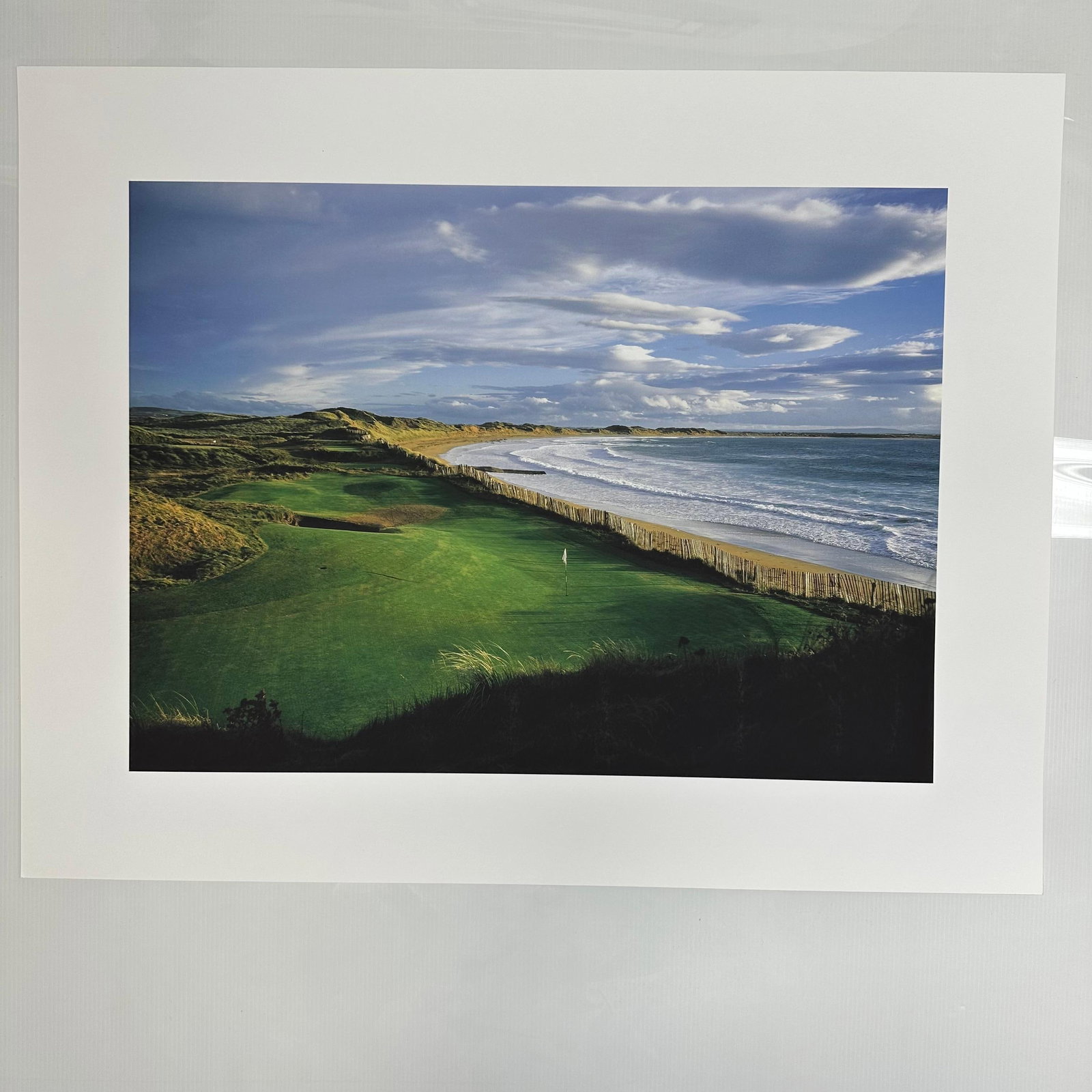 Golf Digest Collection 11th Hole Ballybunion Golf Course Coastal Landscape Photo Print: Golf Digest Collection color photograph print depicting a stunning coastal golf course fairway overlooking the ocean under vivid blue skies and rolling clouds. Unmarked on reverse, includes original e