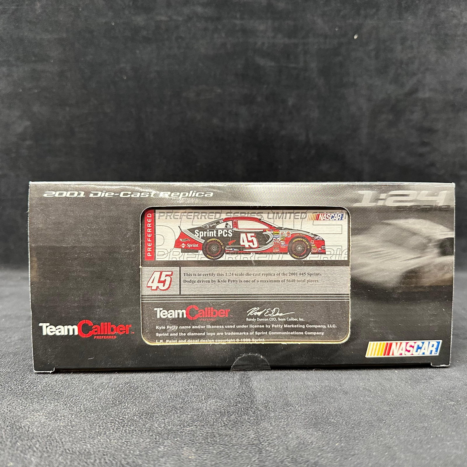Team Caliber Preferred 2001 Kyle Petty 45 Sprint PCS Dodge 1:24 Die-Cast Car: Team Caliber Preferred 1:24 scale die-cast replica of the 2001 NASCAR Dodge driven by Kyle Petty, car number 45, Sprint PCS livery. Limited edition release. Comes with original Team Caliber box, inner