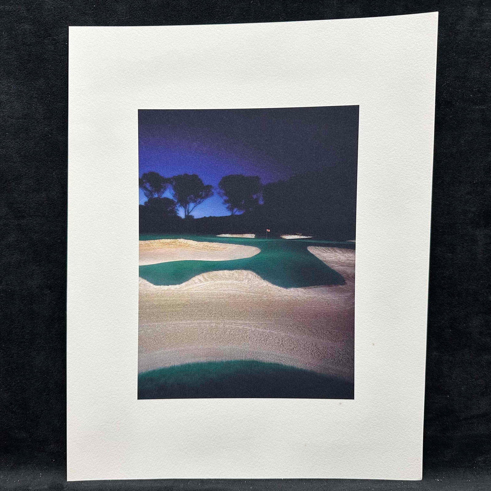 Fine Art Print Lithograph Golf Course Sunset Bunker Landscape GC1: High-quality lithograph photo print depicting a dramatic golf course landscape at sunset, featuring multiple sand bunkers and a glowing blue-dark sky. Printed on textured, heavyweight paper for a gall