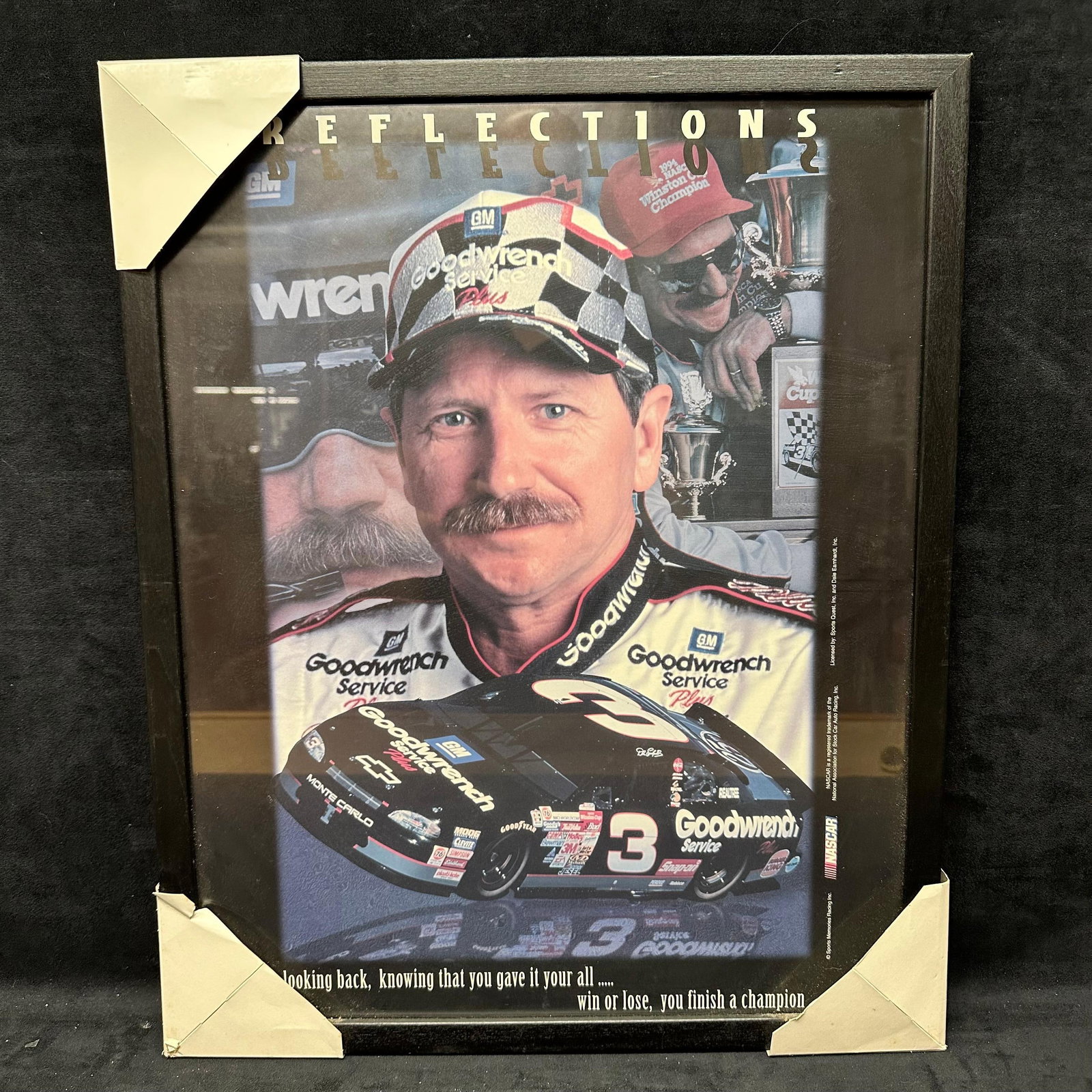 Framed Dale Earnhardt Reflections NASCAR Print Poster: Framed NASCAR-themed print titled Reflections featuring Dale Earnhardt in his Goodwrench Service Plus racing uniform with the #3 Chevrolet Monte Carlo race car. Artwork print poster shows a collage-st