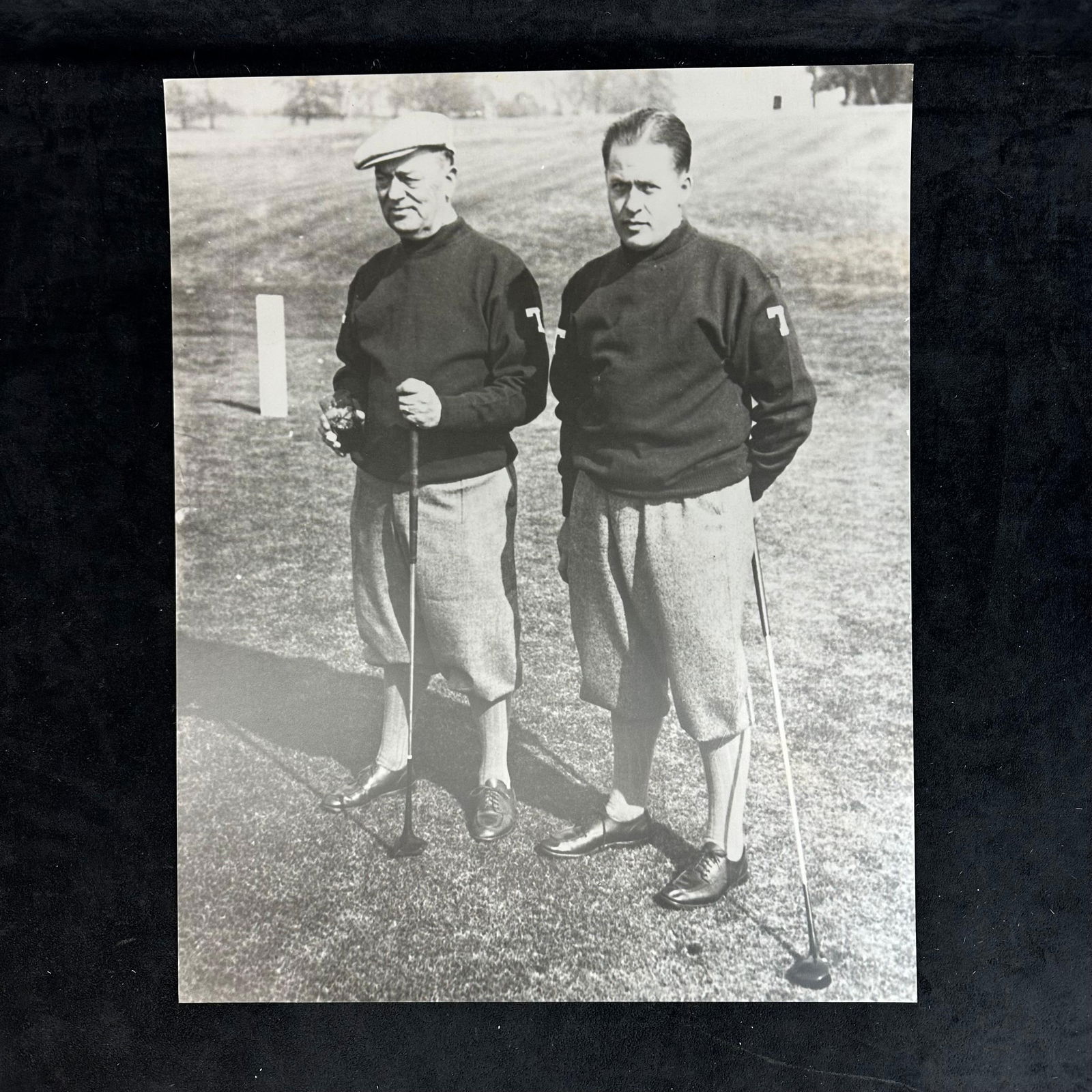 Black and White Golf Photography Print Bobby Jones and Colonel Robert P. Jones Vintage Golfers: Vintage style black and white photograph print capturing legendary golfer Bobby Jones alongside his father, Colonel Robert P. Jones, on the course. The image showcases both men dressed in traditional