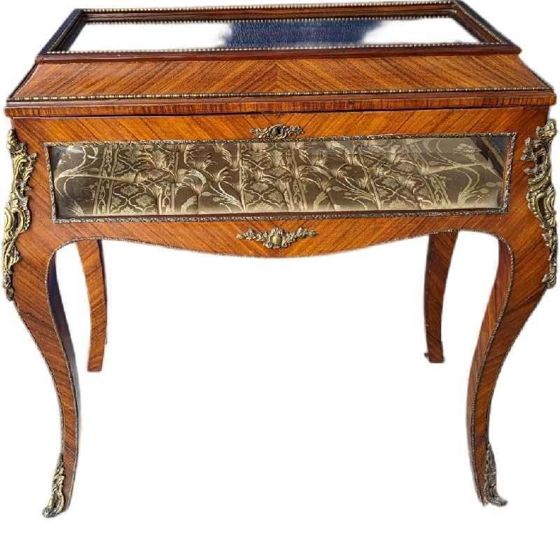 Vintage Wooden Louis XVI Style Vitrine Reproduction: Vintage Wooden Louis XVI Style Vitrine Display With Brass ends and feet. Is 33 1/2" x 19" x 35" and it weighs 50lbs. The maker and date of creation are unknown. There is a small Elephant logo by the l