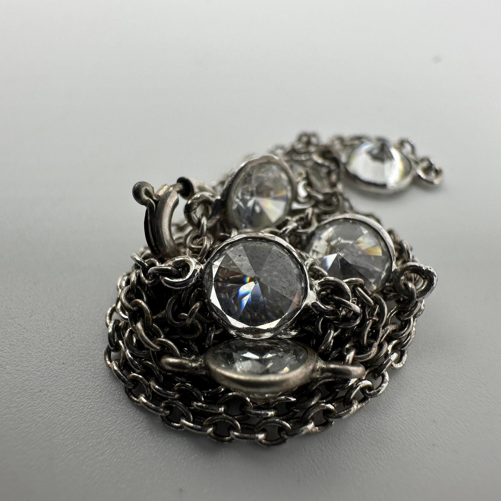 CZ Seven Stone Sterling Silver 925 Necklace Q8: This item is in good pre-owned, previously used/displayed condition with noticeable light wear and surface scratches. Please reference all photos for full details. This piece of jewelry has been teste