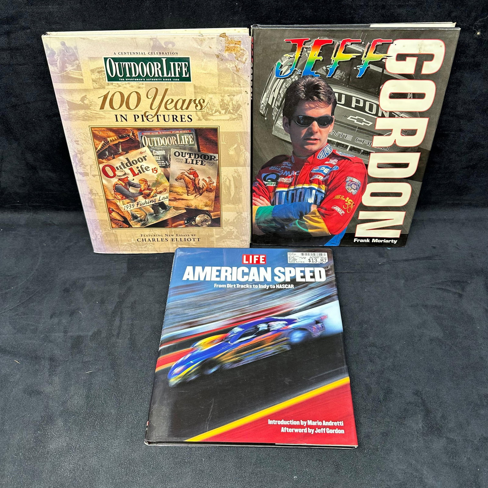 Hardcover Table Books NASCAR Outdoor Life Jeff Gordon Three Book Set: Three books set, including American Speed Life, Jeff Gordon, and Outdoor Life 100 Years in Pictures. These items are in good pre-owned, previously used/displayed condition with noticeable light wear a