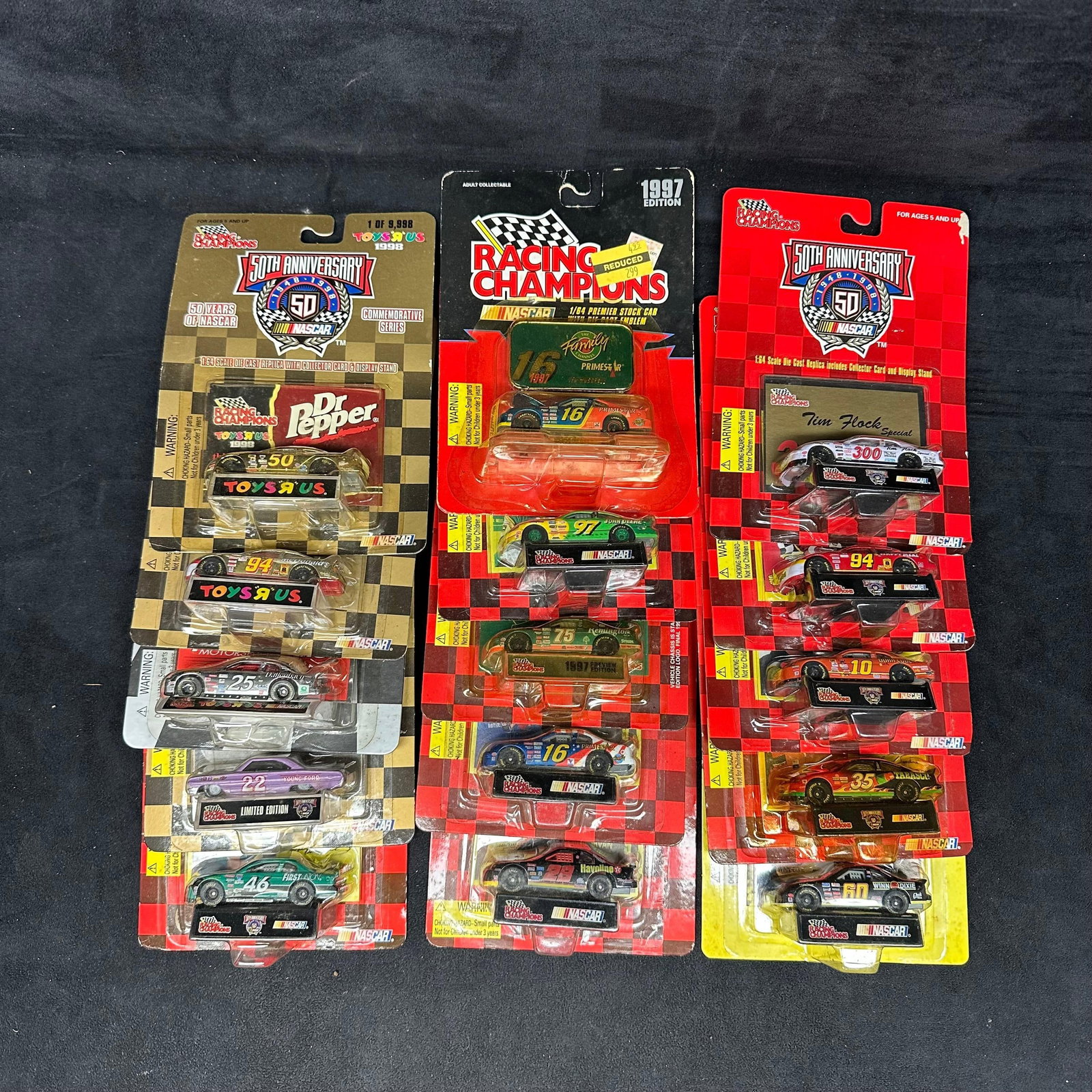 Racing Champions 1:64 Scale Collectors NASCAR Replica Stock Cars Set 15: A variety of NASCAR replica stock 1:64 scale die-cast cars from Racing Champions and Revell. Several NASCAR sponsor brands featured. Fifteen total. These collectibles are in like-new condition, never