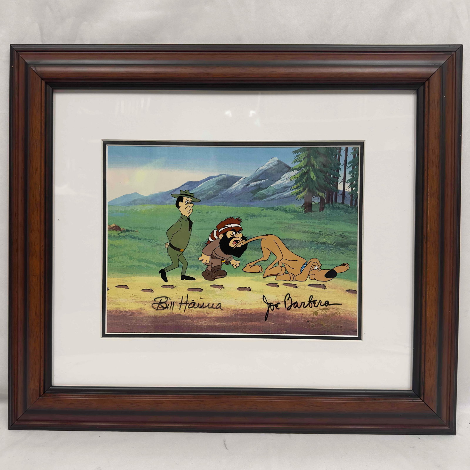 Signed Hanna-Barbera Studio Yogi's Great Escape Hot on The Trail Production Cel Framed: Signed Hanna-Barbera Studio Yogi's Great Escape Hot on The Trail Production Cel Framed. Hand painted production cel with color background. Signed by William Hanna and Joseph Barbera. A unique work