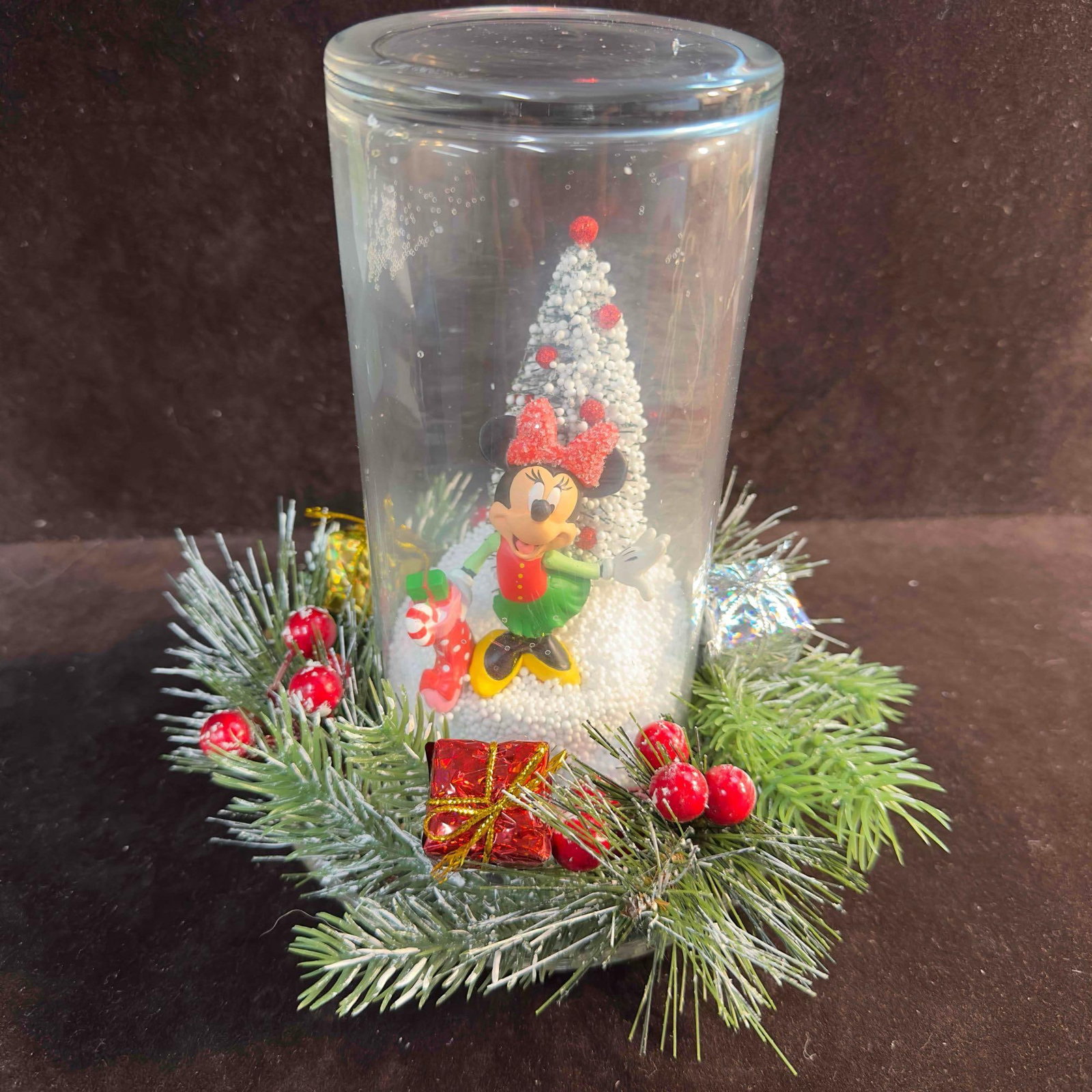 Minnie Mouse Christmas Decor Wreath Glass Decorative Holiday Collectible: Minnie Mouse Christmas Decor Wreath Glass Decorative Holiday Collectible. This holiday decor features Minnie Mouse in a Christmas theme. The inside of the glass doom has Styrofoam pieces creating a sn