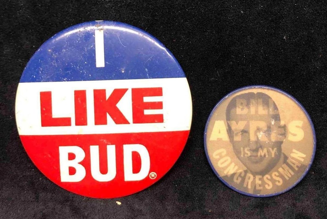 Budweiser I Like Bud Pin & Bill Ayres Is My Congressman Hologram Pin: This lot contains a Budweiser "I Like Bud" pin & "Bill Ayres Is My Congressman" hologram pin. The Bud pin is approx 4" x 4" while the Ayres pin is approx 2 1/2" x 2 1/2". Together the two pins we