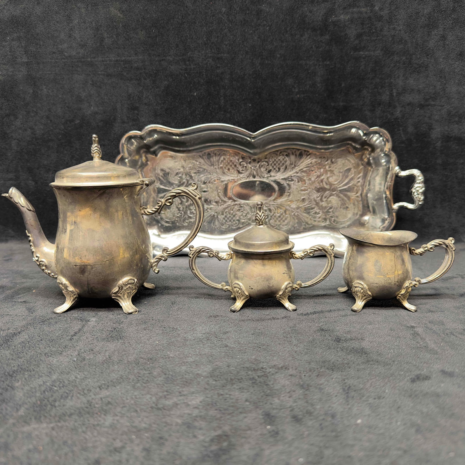 Godinger Mini Silver Plated 3 Piece Coffee Tea Set Teapot Creamer Sugar and Danny Wilson Tray Set: Godinger Mini Silver Plated 3 Piece Coffee Tea Set Teapot Creamer Sugar and Danny Wilson Tray Set. The chrome footed tray is marked Danny Wilson on the bottom. The coffee tea set has GSA label underne