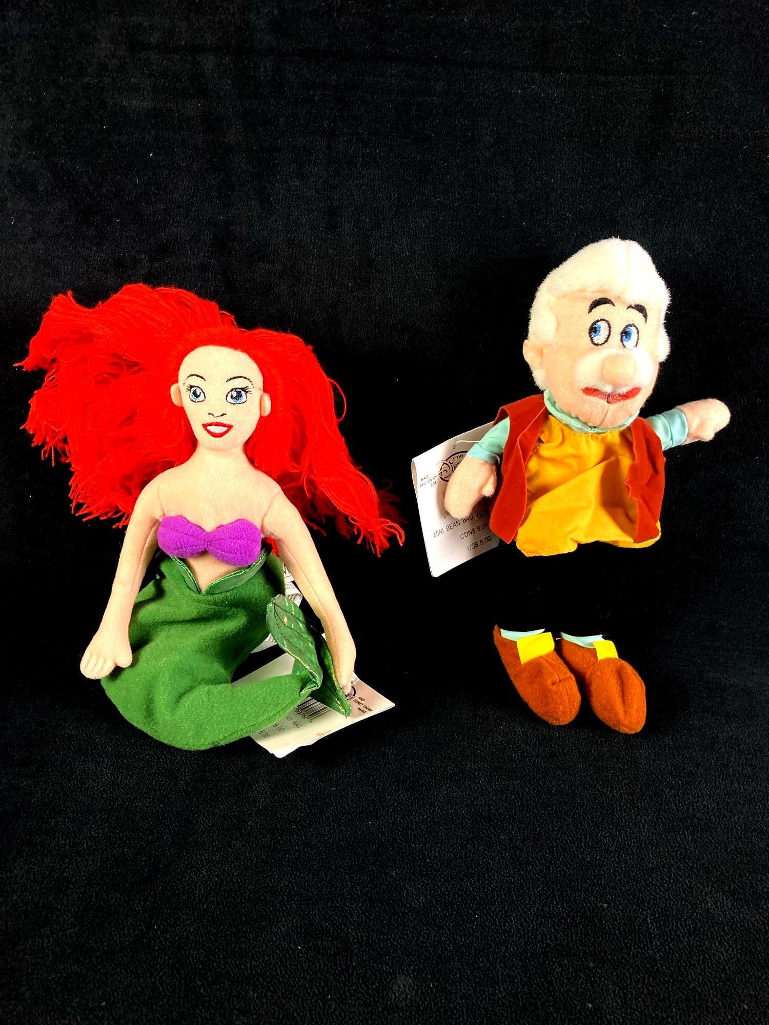 Set of (2) Disney Plush Bean Bag Dolls Ariel and Gepetto: Up for auction is a recent estate find, a set of two Disney bean bag dolls in particular Ariel from the Disney film The Little Mermaid and Gepetto from the Disney film Pinocchio. The dolls came from a