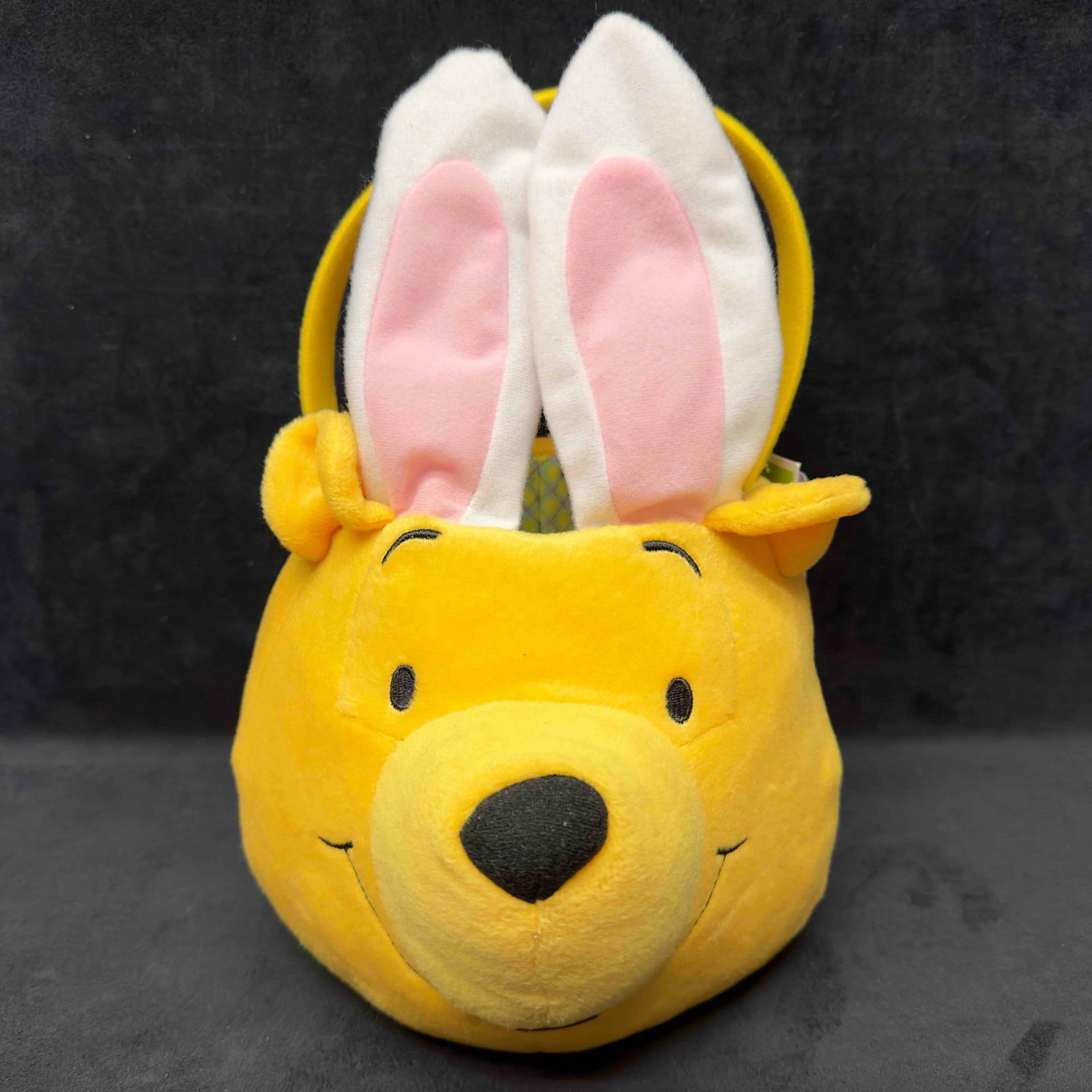 Disney Winnie The Pooh Easter Basket Yellow Bunny Bucket: Disney Winnie The Pooh Easter Basket Yellow Bunny Bucket. This plush Easter basket features Winnie the Pooh with bunny ears. One bunny ear doesn't stand up properly. Comes with original tag still