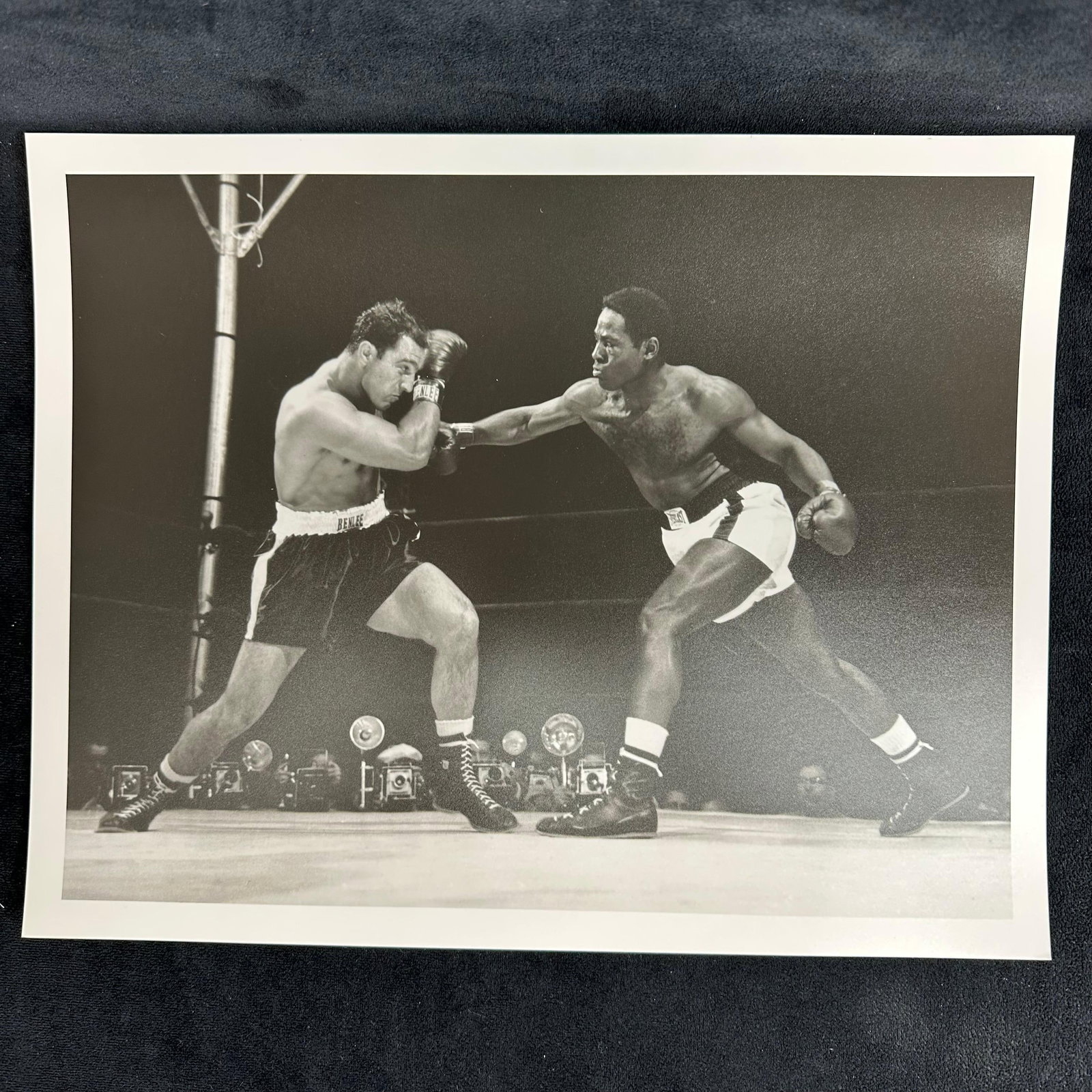 Rocky Marciano and Ezzard Charles Analog Photo Print Action Boxing Black and White Photograph: Black and white boxing analog photograph print, printed on pearl resin-coated photo paper. The image captures an intense mid-action exchange between two fighters in the ring, Rocky Marciano and Ezzard