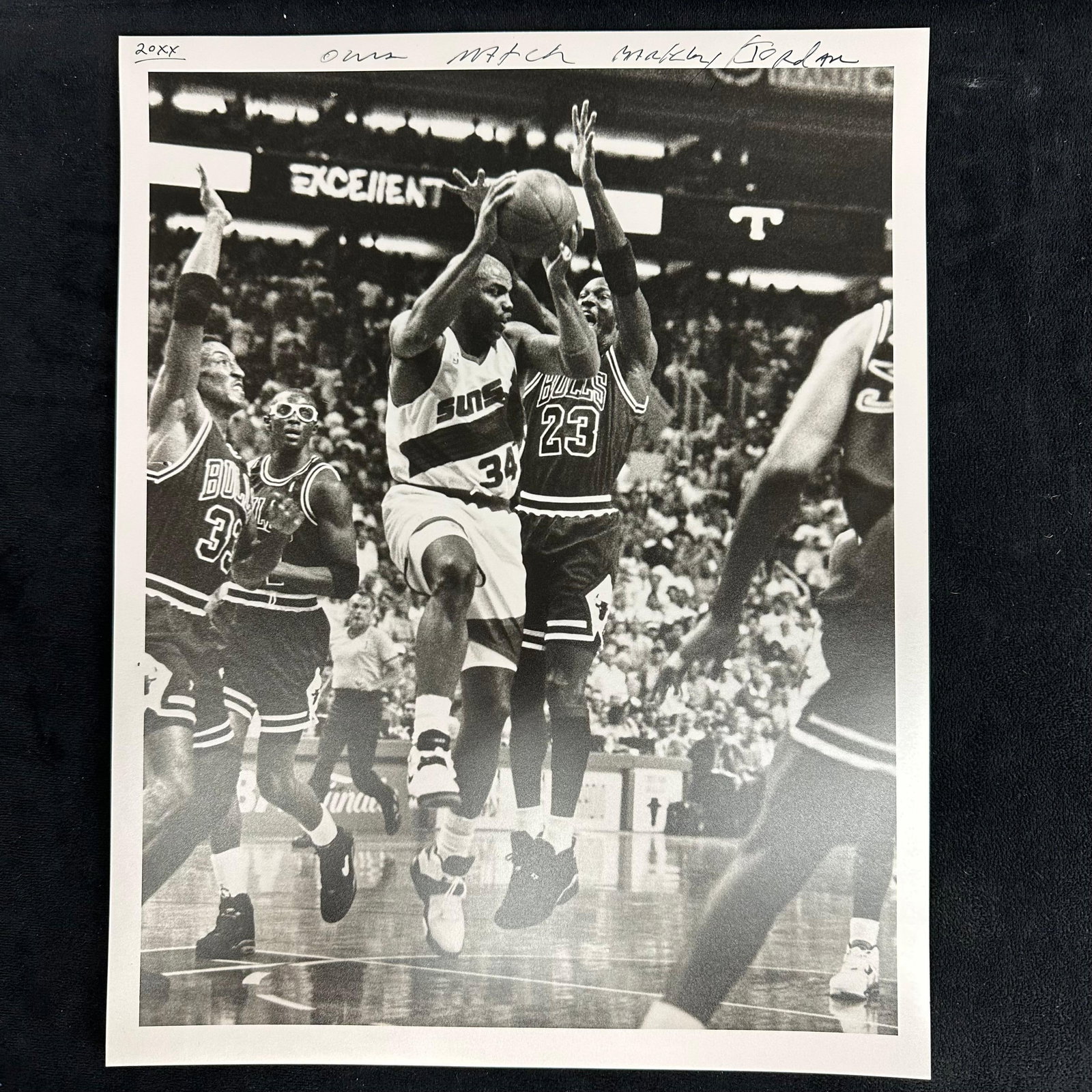 Black and White Sports Silver Gelatin Print Charles Barkley vs Michael Jordan Suns vs Bulls Game: Black and white analog photograph printed on pearl resin-coated photo paper depicting NBA legends Charles Barkley of the Phoenix Suns driving to the basket against Michael Jordan of the Chicago Bulls.