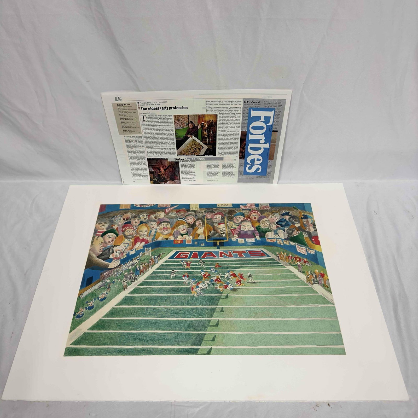 Robert Cenedella Lithograph Color Print The Giants #1: Robert Cenedella Lithograph Color Print The Giants #1. Includes two article prints featuring Robert Cenedella. A few noticeable creases on the print, minor tears, and some wear on the edges. This item