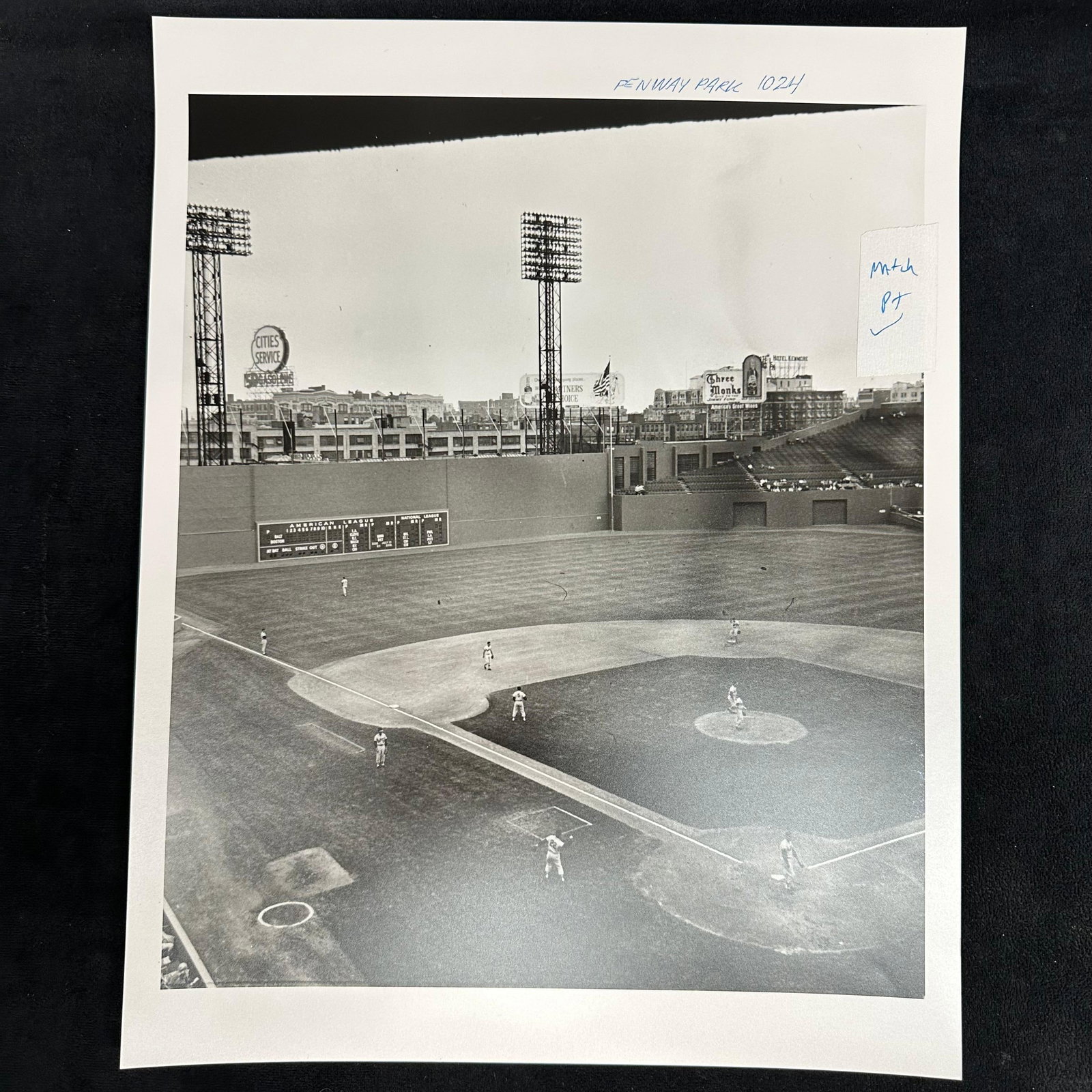 Black and White Analog Photograph Print Fenway Park Baseball Game Scene Boston Red Sox #2: Black and white analog photo print capturing a wide view of Fenway Park during a game. The iconic Green Monster is visible in left field, along with period advertising signs such as Cities Service and