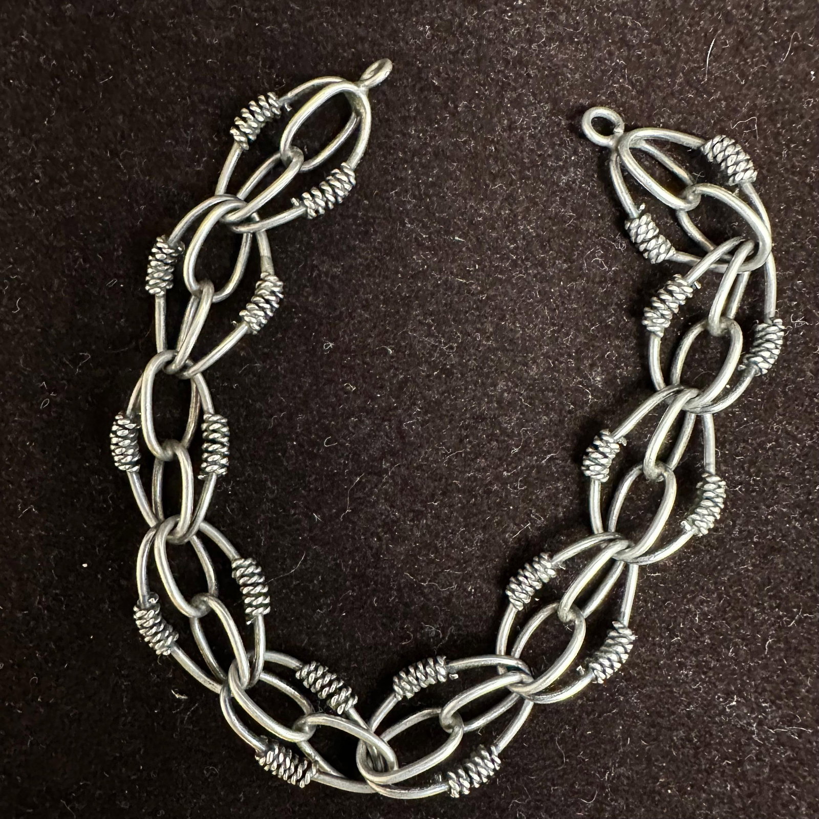 Etruscan Revival Style Silver Rope Motif Link Bracelet: This item is in good pre-owned, previously used/displayed condition with noticeable light wear and surface scratches. Please reference all photos for full details. This piece of jewelry has been teste