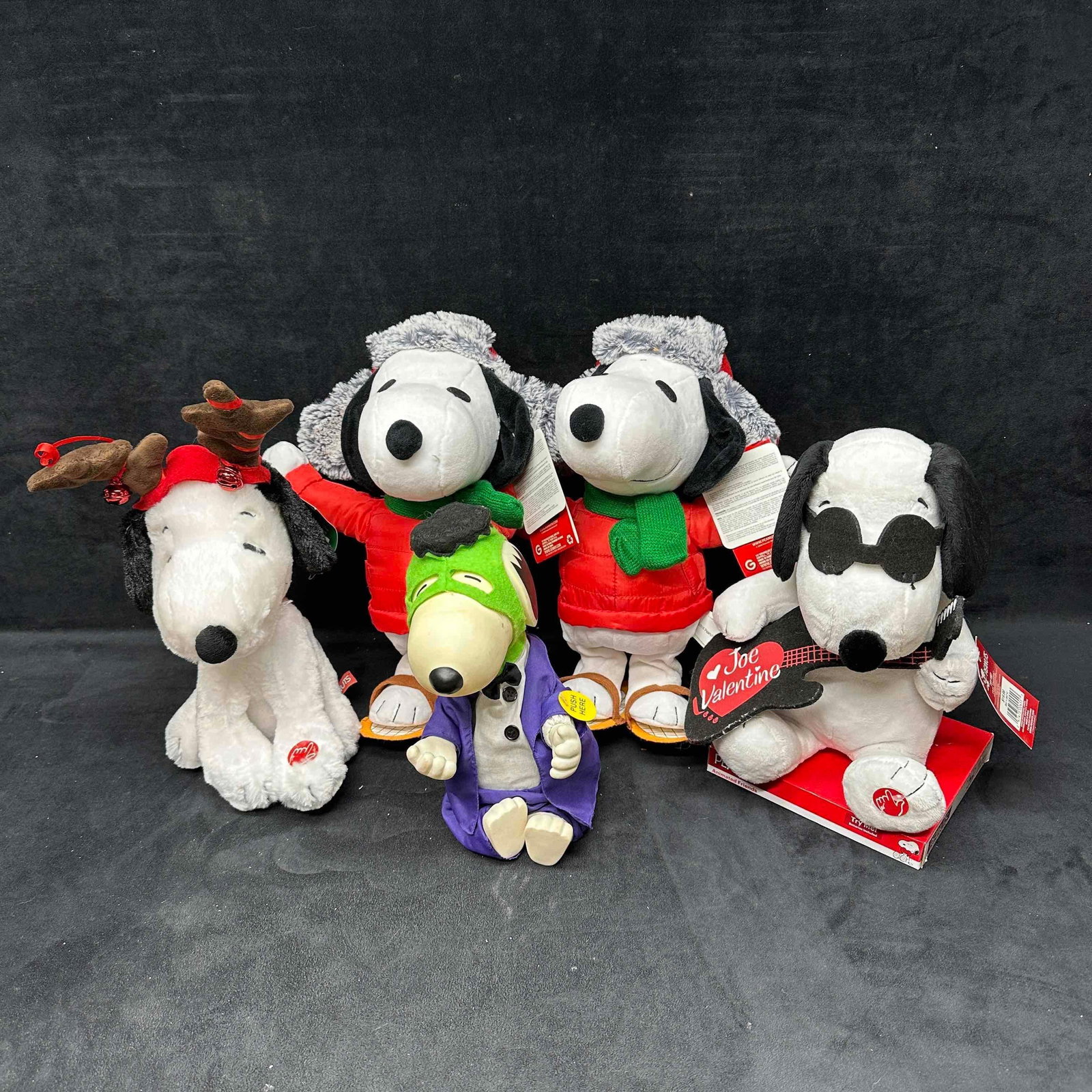 Charlie Brown Snoopy Holiday Animated Sound Plush Collection Gemmy: A festive collection of Snoopy plush toys, Halloween, Christmas, and Valentine's Day holidays represented. Some plush toys make noise, sound, and are animated. The Snoopy dressed as Frankenstein i