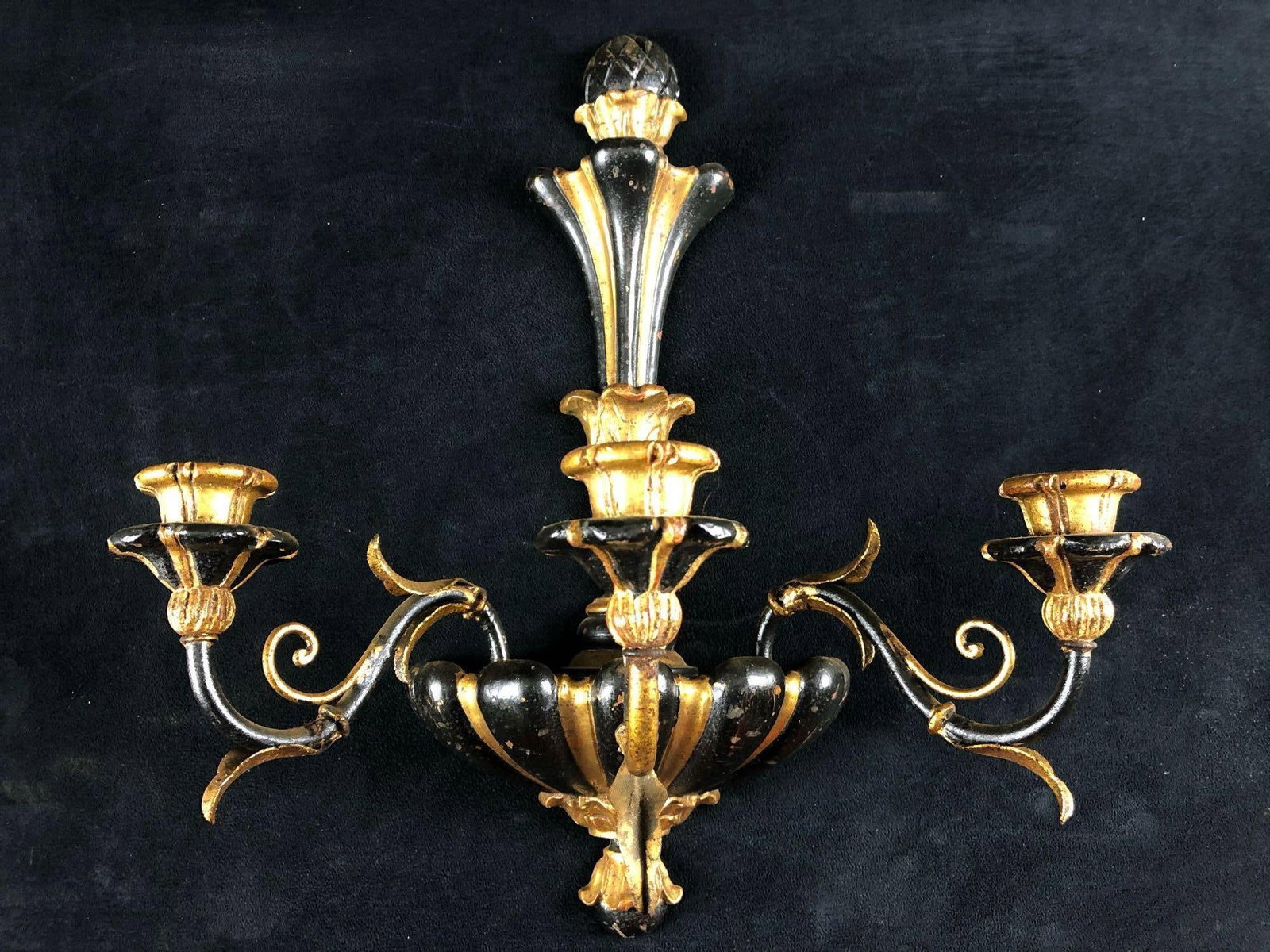 Beautiful Midcentury Hollywood Regency Italian Gothic Wood & Metal Gilded Candelabra Wall Sconce: This is a beautiful Midcentury Hollywood Regency Italian metal and wood candelabra with three arms and three wood candle holders. This stunning black & gold gilded piece is in very