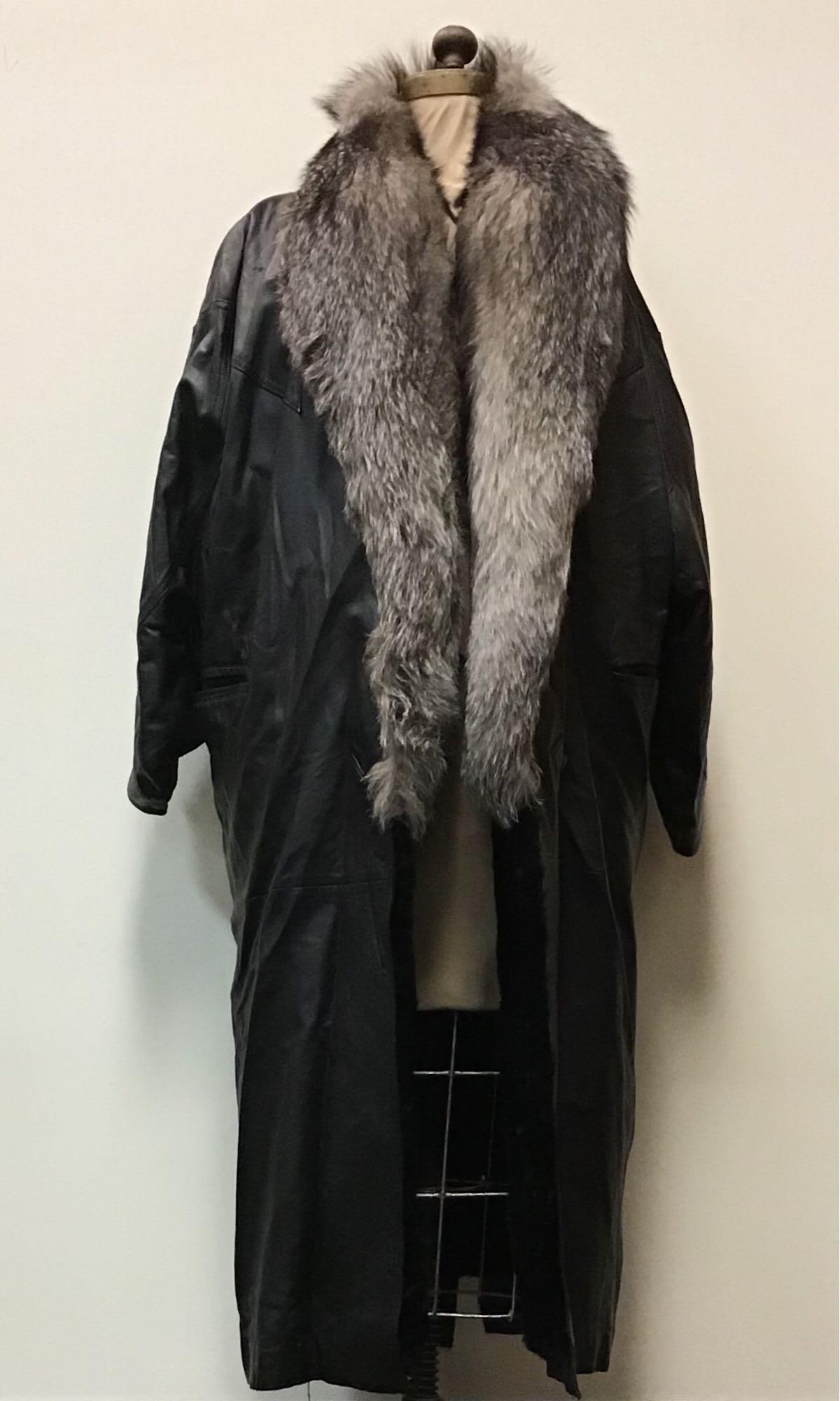 Black Leather Coat Indigo Fox Collar Fur Jacket: Black Leather Coat Indigo Fox Collar Fur Jacket. Made by an unknown manufacturer. This coat features a removable rabbit fur interior lining with fox trim on the collar and two exterior pockets. The le
