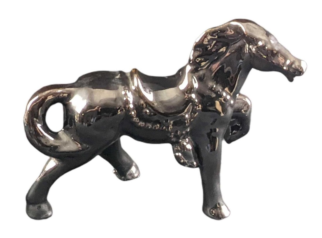 Vintage Ceramic Horse Figurine With Reflective Glaze: Vintage Ceramic Horse With Reflective Glaze. The maker and date of creation are unknown. Is approx 10" x 3" x 9" and it weighs 1.89lb. The figurine is in a good, used condition with light wear.