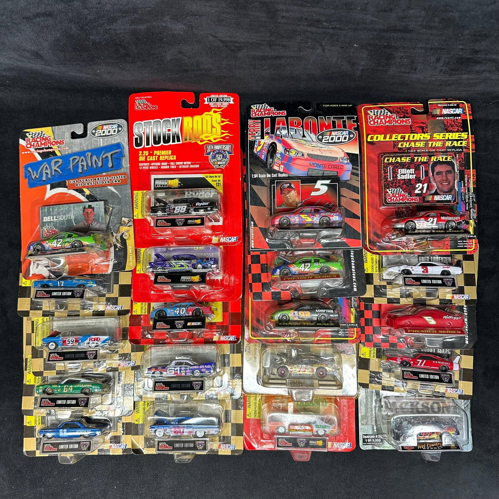 Twenty Racing Champions NASCAR Diecast Car Collectibles Bellsouth: Group of 20 Racing Champions NASCAR diecast cars, mostly 1:64 scale and carded. Includes examples from series such as War Paint, Stock Rods, Terry Labonte NASCAR 2000, Collectors Series Chase the Race