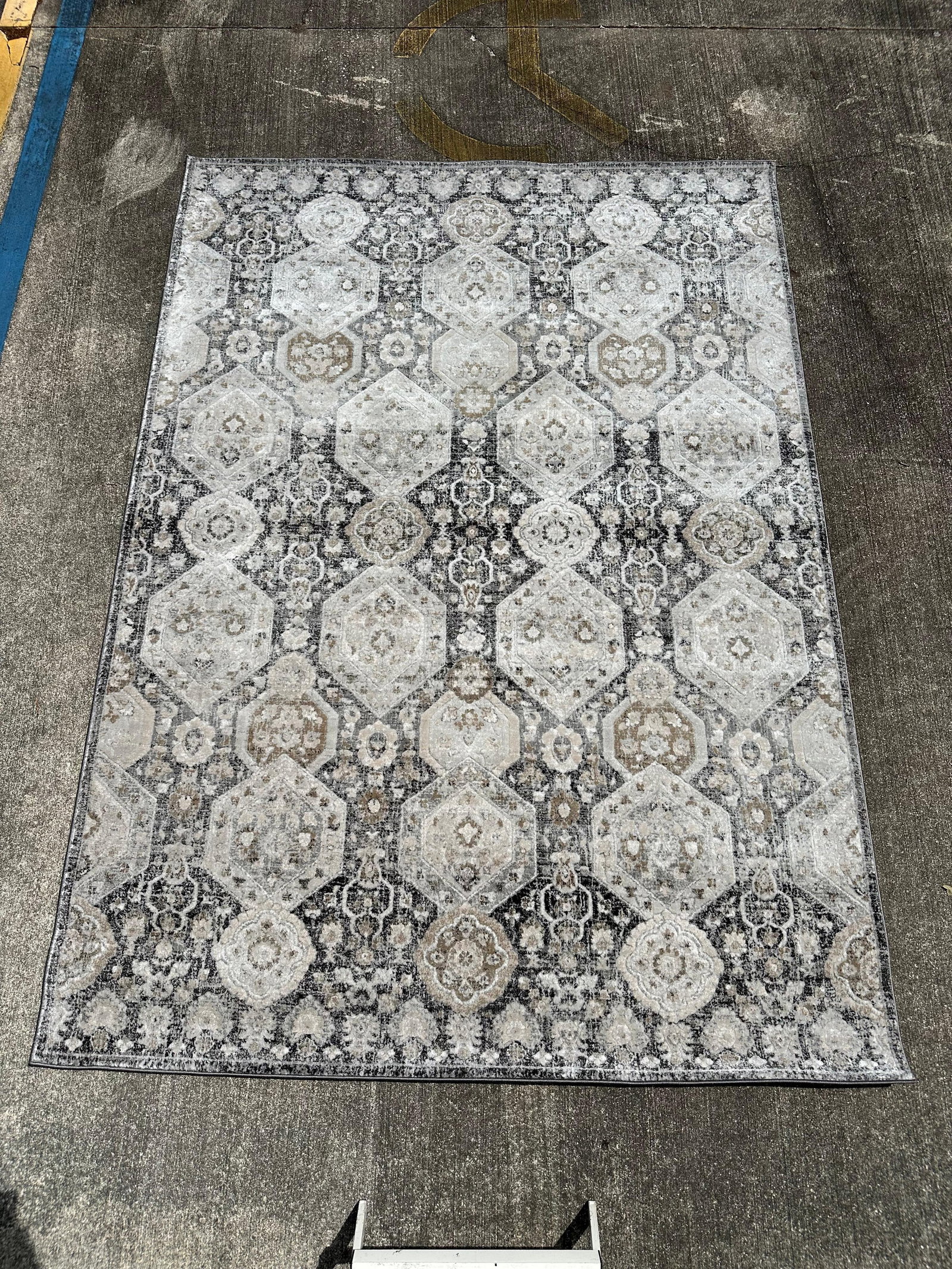 Minoa Area Rug HauteLoom IGO 2307 6ft 7in x 9ft Gray Cream Geometric Pattern: Machine-made area rug from the Minoa collection by HauteLoom, collection code IGO-2307. Measures approximately 6 ft 7 in by 9 ft. Features a geometric medallion style pattern in gray, cream, and neutr