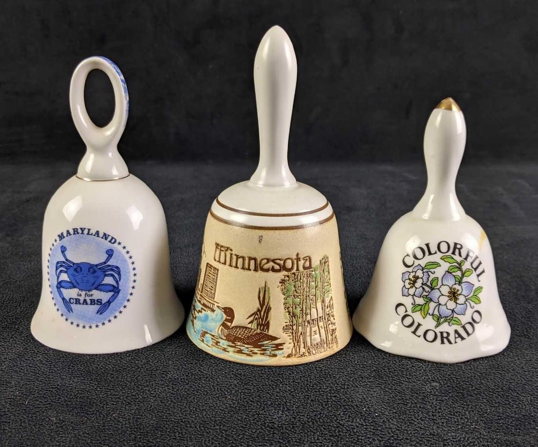 State Bells: State Bells There are three state bells in this lot They are all in good condition. There may be some adhesive discoloration. They all ring beautifully. We have (1) Maryland, 5in tall (2)