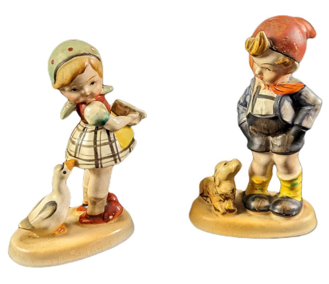 Vintage Japanese Like Hummel Boy & Girl Figurines: These hand-painted ceramic figures are like the ever-popular Hummel figurines but were made in Occupied Japan. This lot includes: (1) Girl With Goose. Is approx 3 1/2" x 1 1/4" x 5" and i