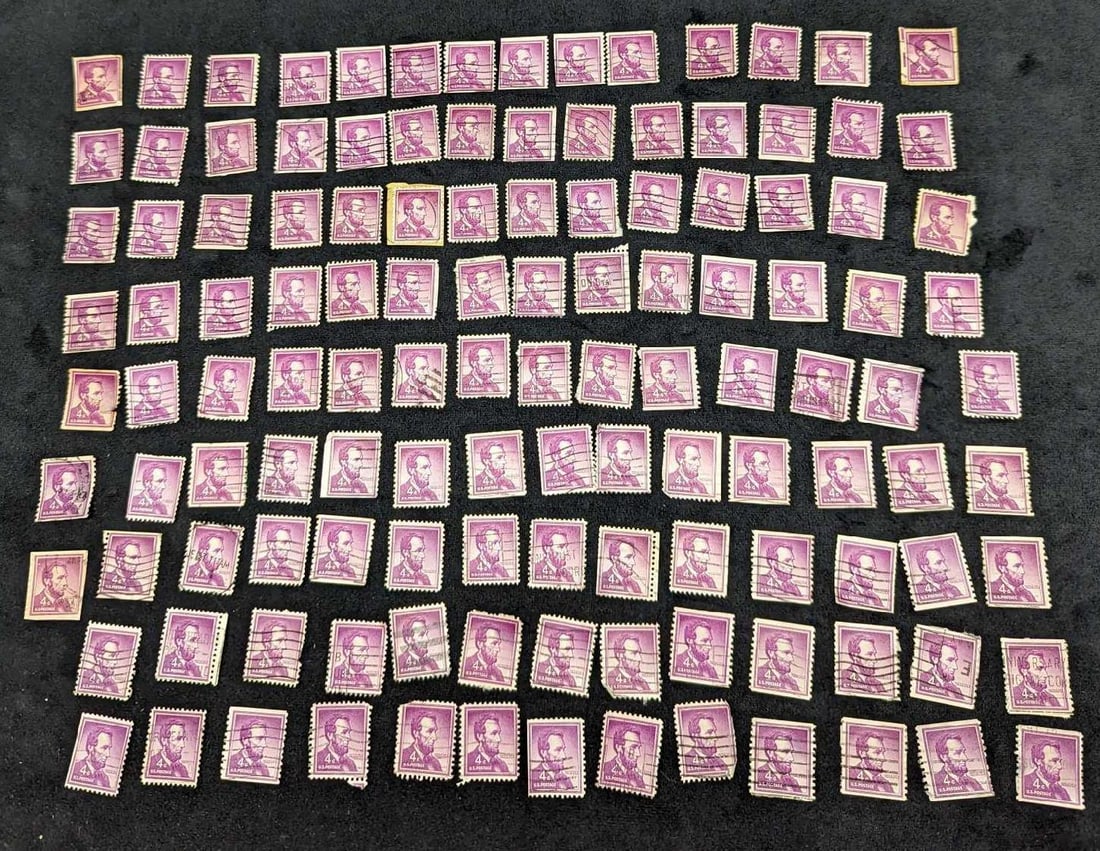 127 US Lincoln 4 Cent Postage Stamps: 127 US Lincoln 4 Cent Postage Stamps. Each stamp is approx 3/4" x 1" and together they weigh 0.01lb. All stamps are post-marked and appear to have been removed from envelopes as the gum is removed and