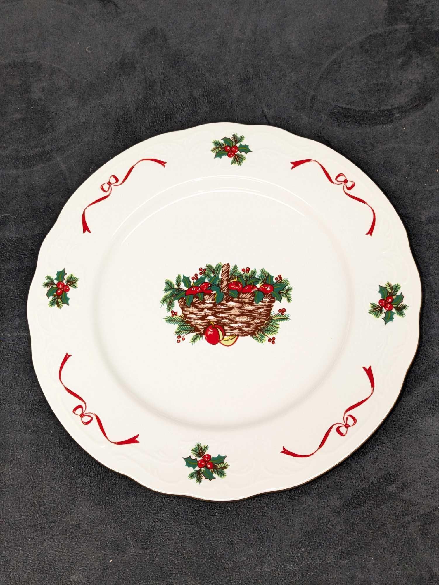 Menuet Basket Of Cheer China Dinner & Serving Plate And Saucer: Menuet Basket Of Cheer China Dinner & Serving Plate And Saucer. This lot includes: (2) Retired Menuet Basket Of Cheer China Dinner Plates. Each is approx 10 1/2" x 10 1/2" x 1". (1) R