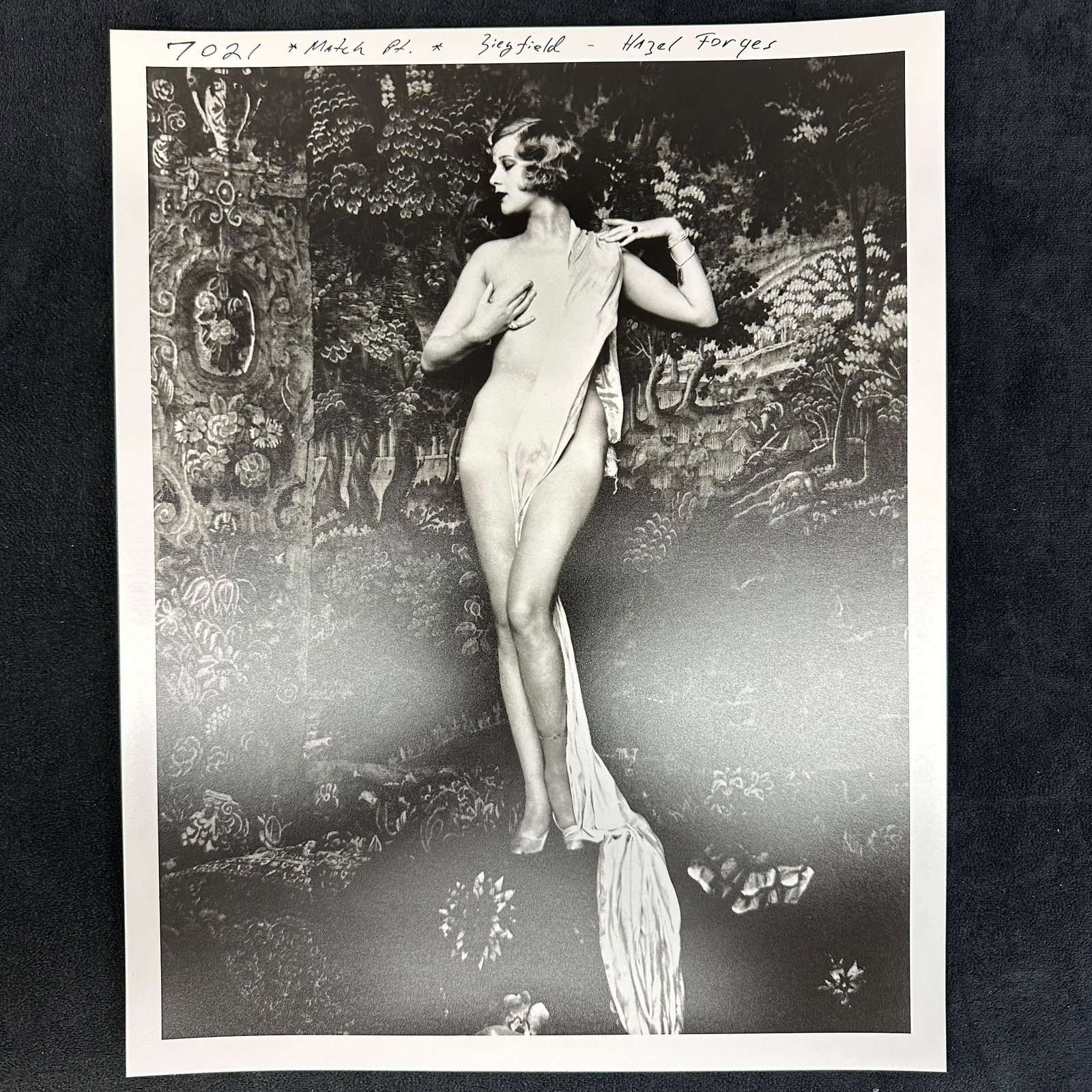 Analog Photo Print Hazel Forbes Ziegfeld Model Black and White: Black and white analog photo print featuring Hazel Forbes, noted Ziegfeld model and actress, posed against a richly patterned backdrop. Striking composition with draped fabric, showcasing the elegance