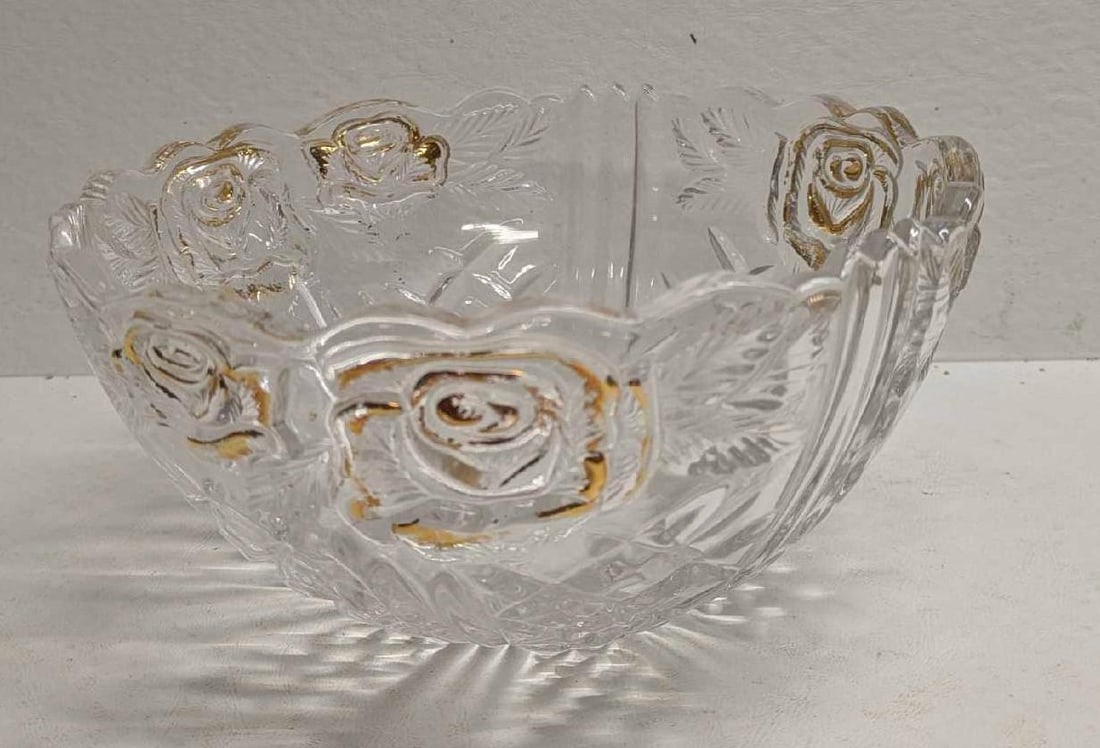 Vintage Clear Glass Bowl With Raised Gold Flower Design: Vintage Clear Glass Bowl With Raised Gold Flower Design. The maker and date of creation is unknown. The bowl is approx 4 1/4" x8 1/2" x 8 1/2" and it weighs 3.27lbs. The gold trim/color has some wear