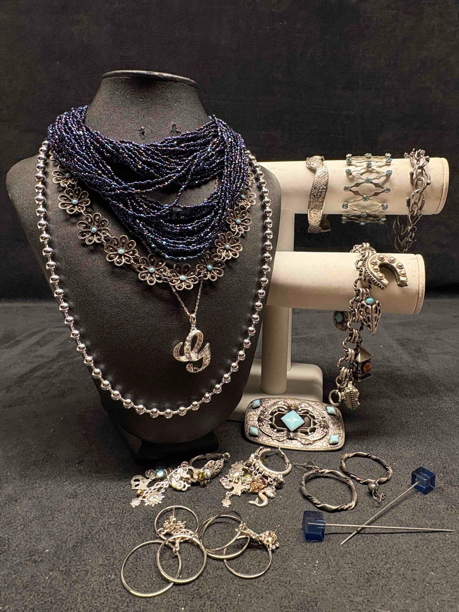 13pc Blues and Silvers Midnight Veil Costume Jewelry Collection: This lot contains 13 pieces of pre-owned costume jewelry, paired together in a stylized set. Each piece is in good conditions, with wear and tear over the years visible on some of the jewelry. Please 
