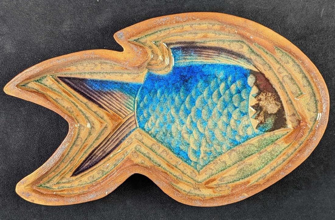 Handmade Clay With Glass Fish Wall Art: Handmade Clay With Glass "Feeding Fish" Wall Art. This was signed by the artist on the back. This has a 19" x 1" x 12" and it weighs 4lbs. The wall art sculpture is in a good, used condition with