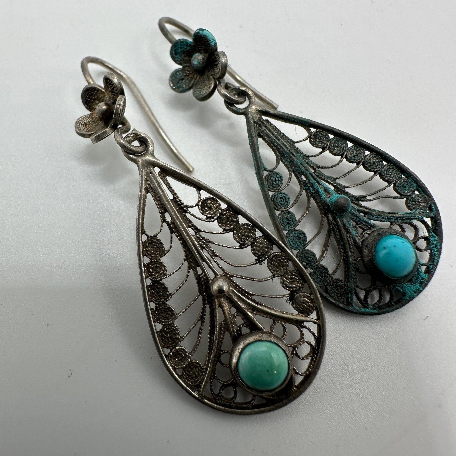 Turquoise Accent Floral Silver 800 Dangle Earrings: This item is in pre-owned, previously used/displayed condition with noticeable light wear and surface scratches. Please reference all photos for full details. This piece of jewelry has been tested and