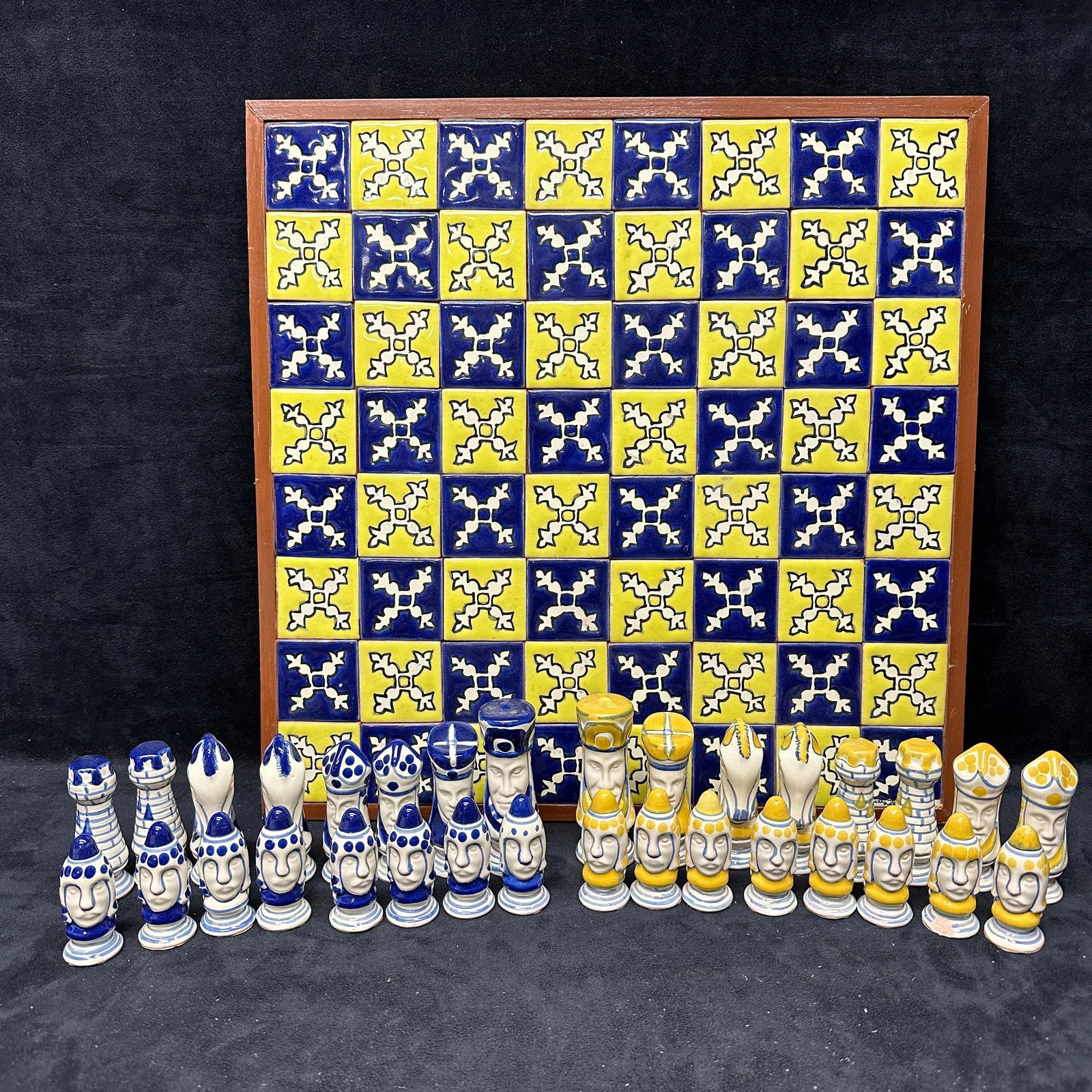 Talavera Puebla Mexico Hand-Painted Ceramic Chess Set with Tile Board: Hand-painted Talavera pottery chess set from Puebla, Mexico, featuring figural ceramic pieces in blue and yellow glaze. Includes full set of 32 pieces with stylized human face motifs and traditional f