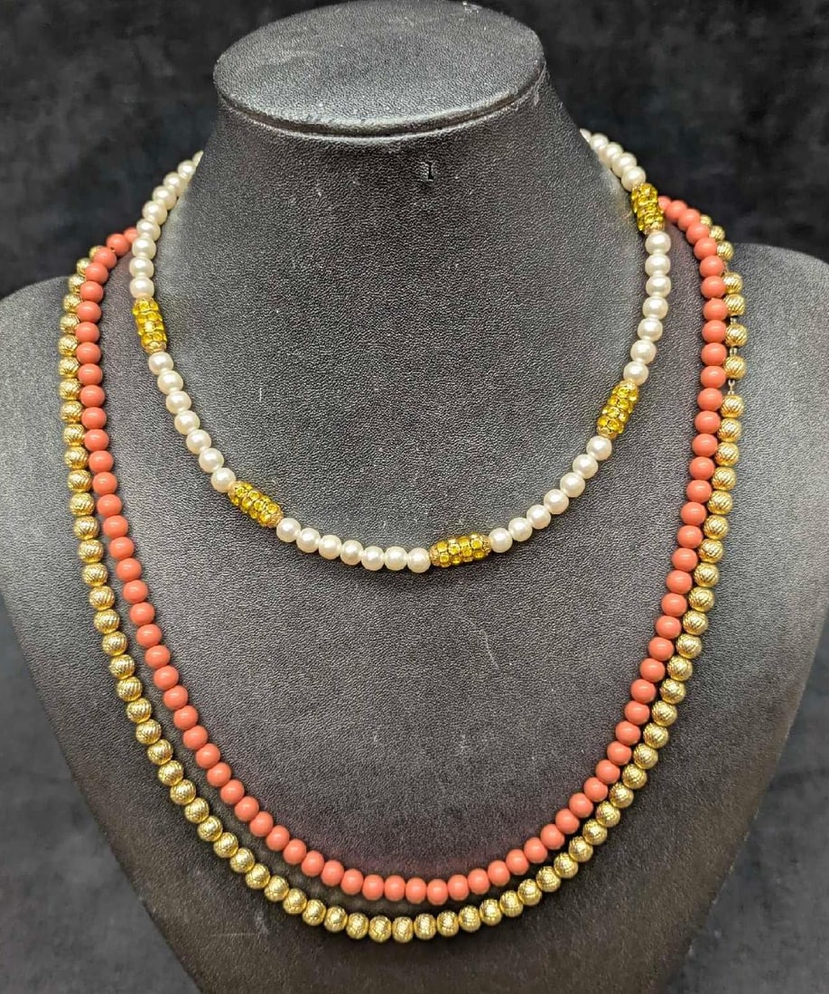 Faux Pearl And Yellow Crystal And Gold Tone And Pink Faux Coral Necklaces: Faux Pearl And Yellow Crystal And Gold Tone And Pink Faux Coral Necklaces. This lot includes: (1) Faux Pearl And Yellow Crystal Necklace. This is approx 16" (1) Gold Tone And Pink Faux Coral Doubl