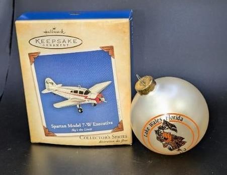 Lot Of Two Travel Ornaments With An Special Exclusive Hallmark Ornament: This lot includes one Hallmark Keepsake "Spartan Model 7-W Executive: Sky's The Limit" from 2004. This is approx 4" x 3" x 1". This also comes with an unmarked Hallmark Memory card. "Lake Wales, 