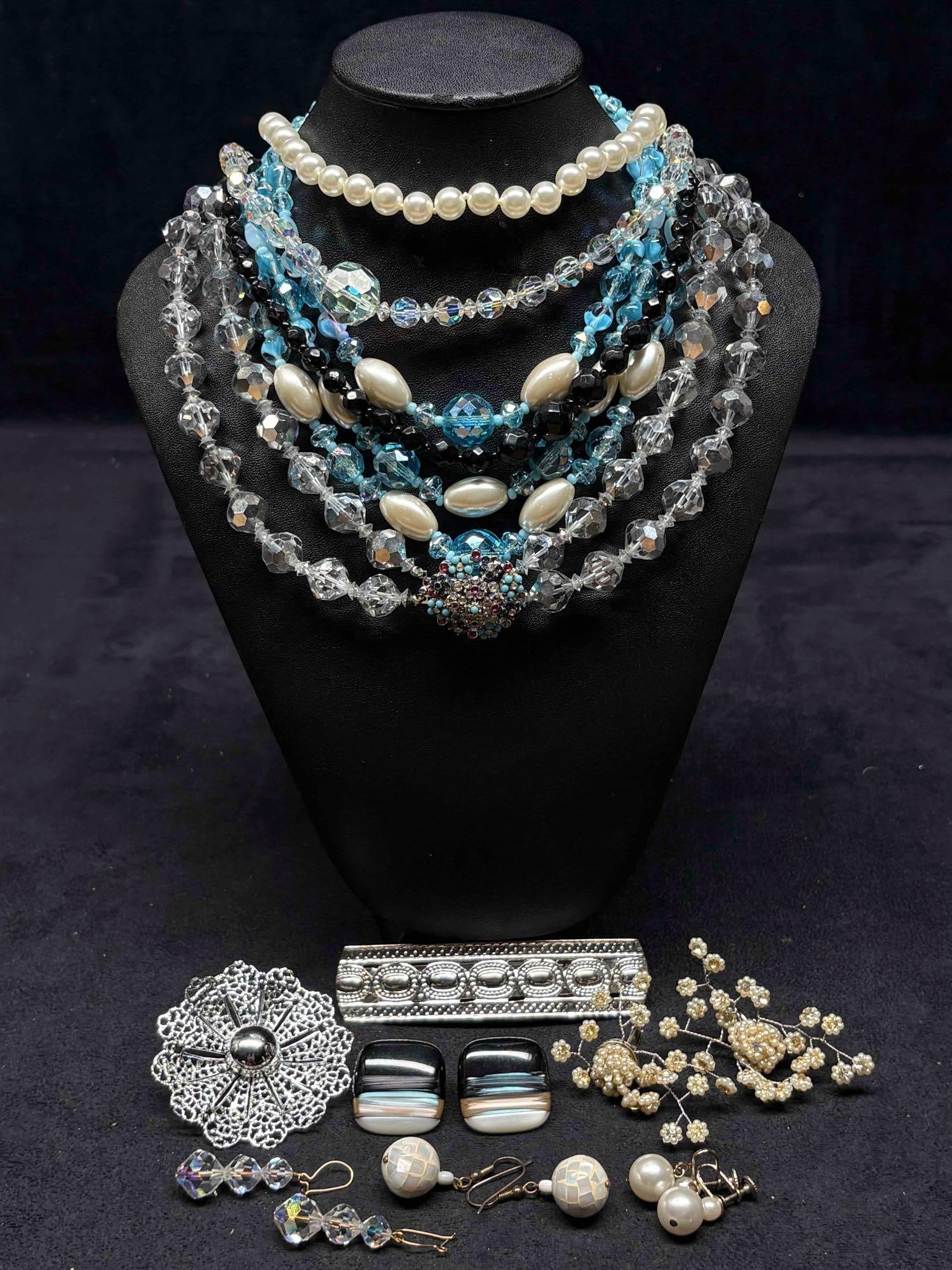 12pc Cool Toned Glaciers Edge Costume Jewelry Collection: This lot contains 12 pieces of pre-owned costume jewelry, paired together in a stylized set. Each piece is in good conditions, with wear and tear over the years visible on some of the jewelry. Please