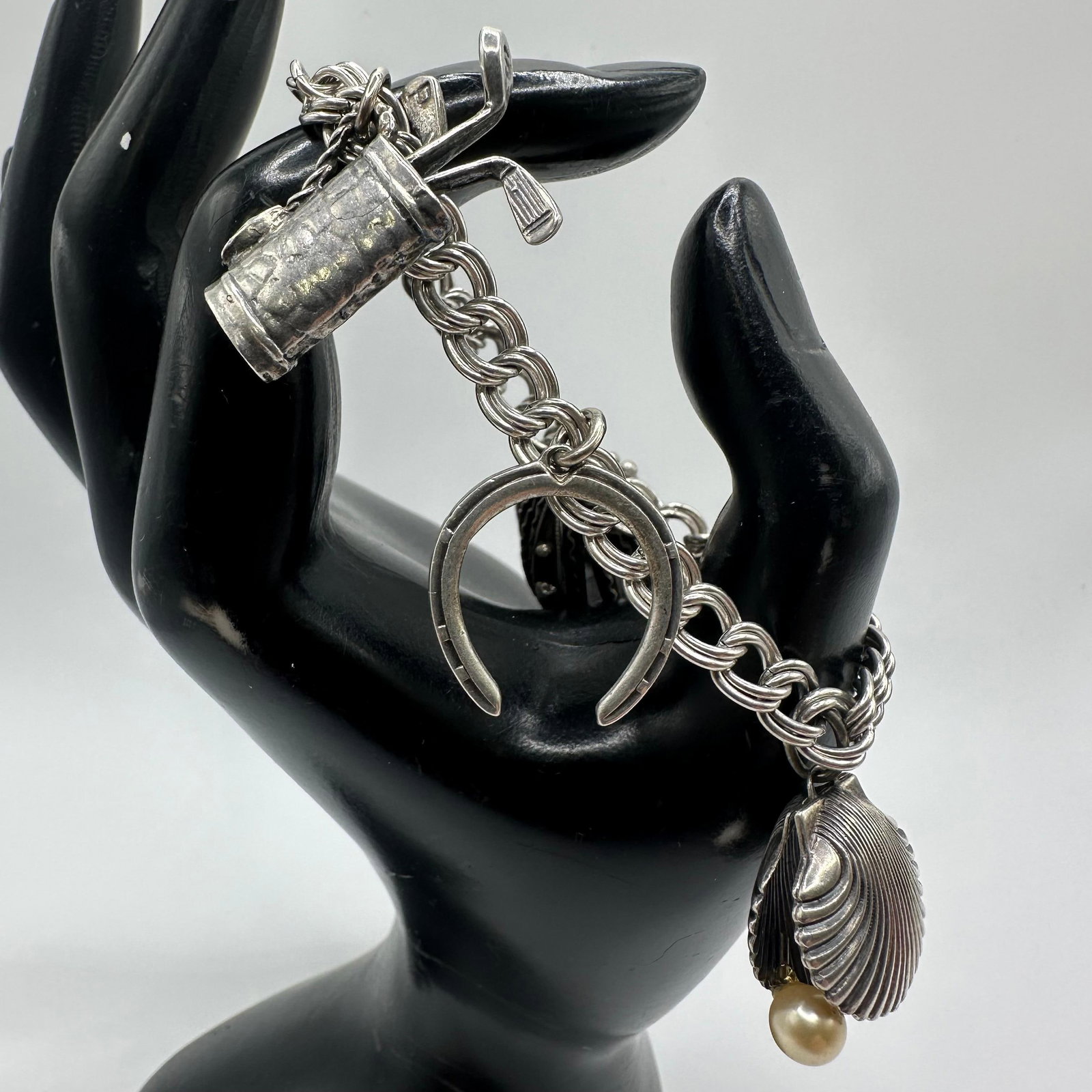 Sterling Vintage Charm Bracelet Heart Seashell Golf Bag Q77: This item is in good pre-owned, previously used/displayed condition with noticeable light wear and surface scratches. Please reference all photos for full details. This piece of jewelry has been teste