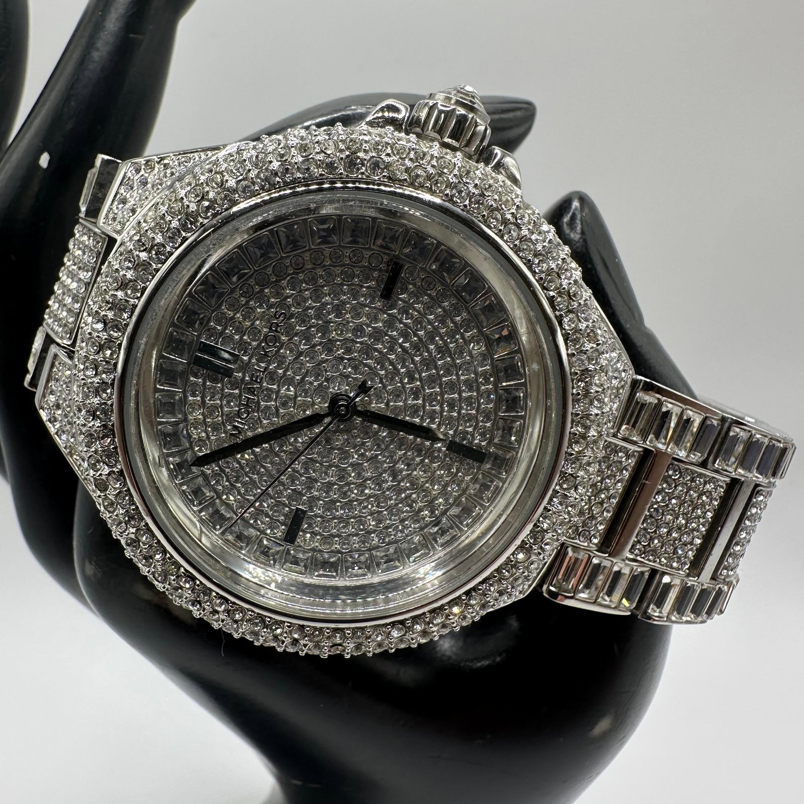 Michael Kors MK5869 Camille Silver Tone Crystal Encrusted Womens Watch: Michael Kors wristwatch model MK 5869 featuring a stainless steel case and bracelet with extensive crystal pave throughout the bezel, dial, and links. Round dial with quartz movement and baton hour ma