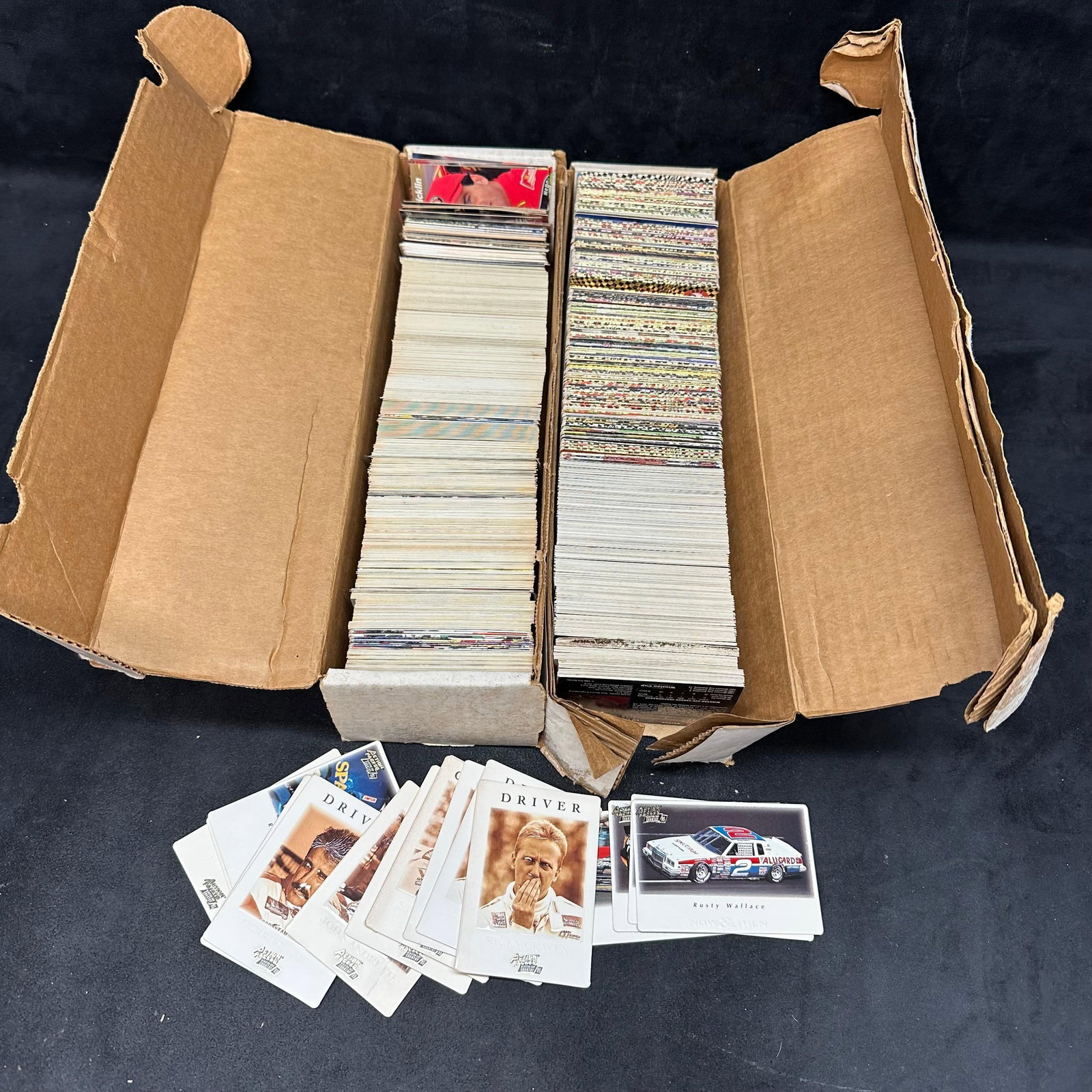 Large Lot NASCAR Trading Cards Action Packed Pro Set Maxx Mixed Collection Two Boxes: Large mixed lot of NASCAR trading cards, primarily from the early to mid-1990s. Includes a substantial quantity of cards stored in two long boxes along with additional loose stacks. Brands observed in