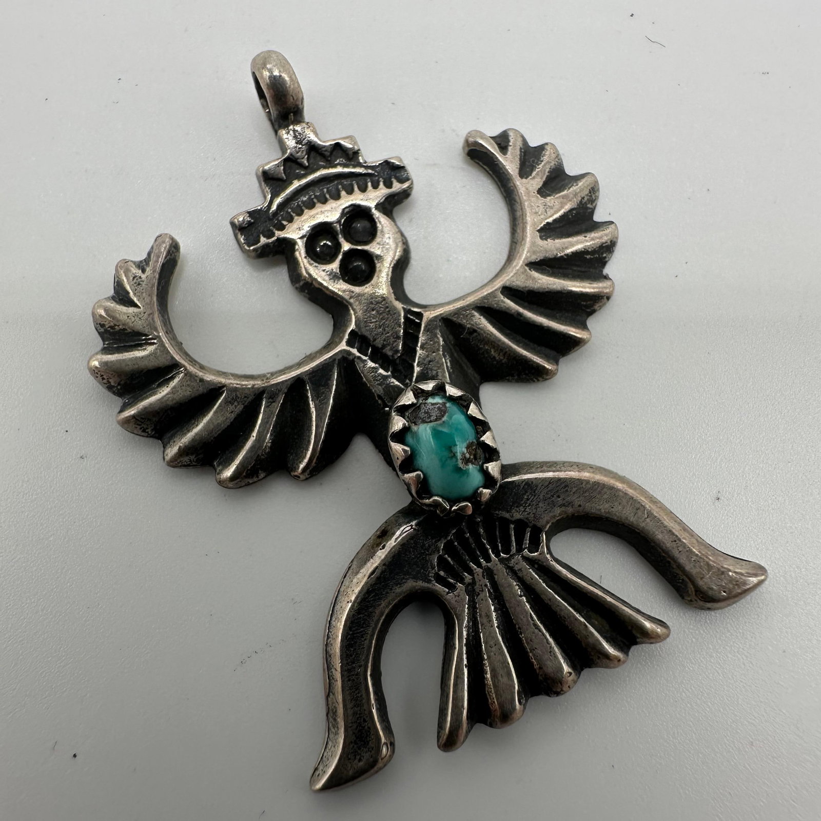 Zuni Style Knifewing Silver Pendant with Small Turquoise Q81: This item is in good pre-owned, previously used/displayed condition with noticeable light wear and surface scratches. Please reference all photos for full details. This piece of jewelry has been teste