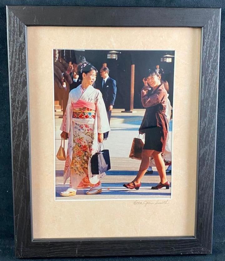Etta Jean Juge Japanese Women Photo: Etta Jean Juge Japanese Women Photo Photo by Etta Jean Juge, showing two women in Japan with shopping bags. One woman is in traditional kimono, and the other is in modern clothing, highlighting the co