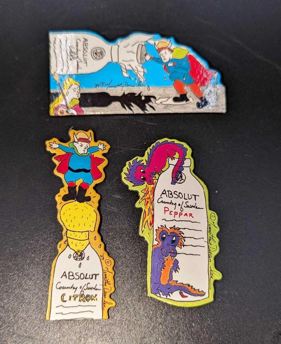 3 Absolut Vodka Peppar Advertising Art Pins / Brooches D: 3 Absolut Vodka Peppar Advertising Art Pins / Brooches D. By Timothy Dean Lee. Each is made of a Laminated Art Board. This was released from the year 1990 to the year 1991. The set is approx 1 5/8"x