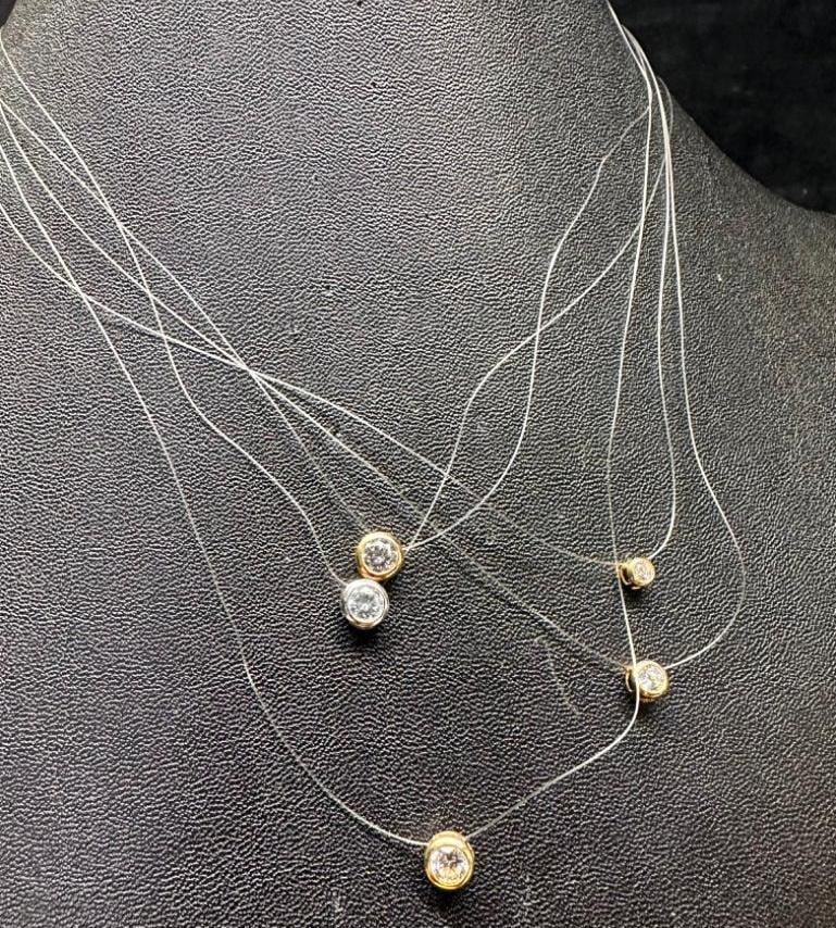 14k Clasp CZ "Floater" Necklaces: This piece of jewelry has been tested and researched prior to listing. Please view all our pictures they are part of our description. DETAILS: Metal - 14k Gold (clasps), base metal (pendants) Color -