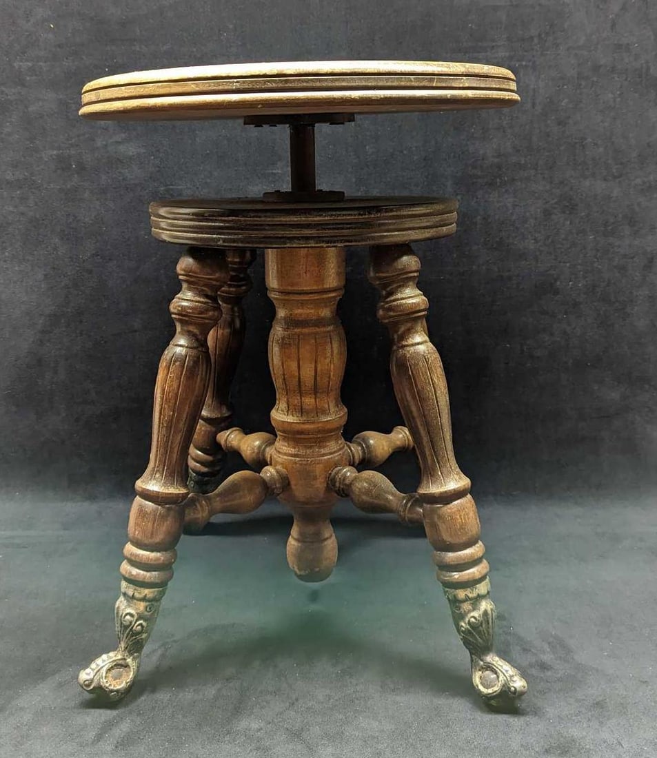 Antique Swivel Adjustable Height Piano Stool: Antique Swivel Adjustable Height Piano Stool. From the 1890s. Made of solid rosewood. The stool is approx 13 3/4" x 13 3/4" x 19 1/2" and it weighs 15lbs. The feet have some wear and patina loss. Ther