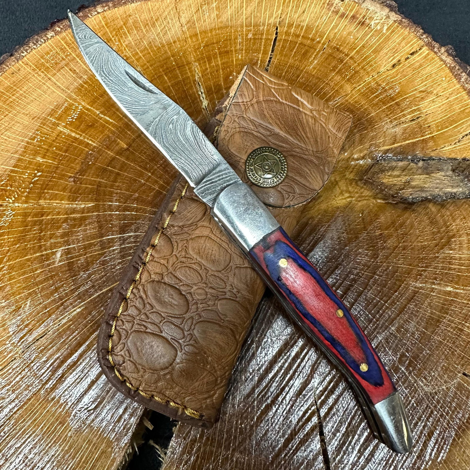 MHS Cutlery Steel Folded Blade Pocket Knife Aqua Pink Design Handle Q95: Folding blade pocket knife by MHS Cutlery featuring a layered patterned steel blade and decorative spine work. The decorative handle has a contoured, aqua blue and pink wood/resin-style grip with meta
