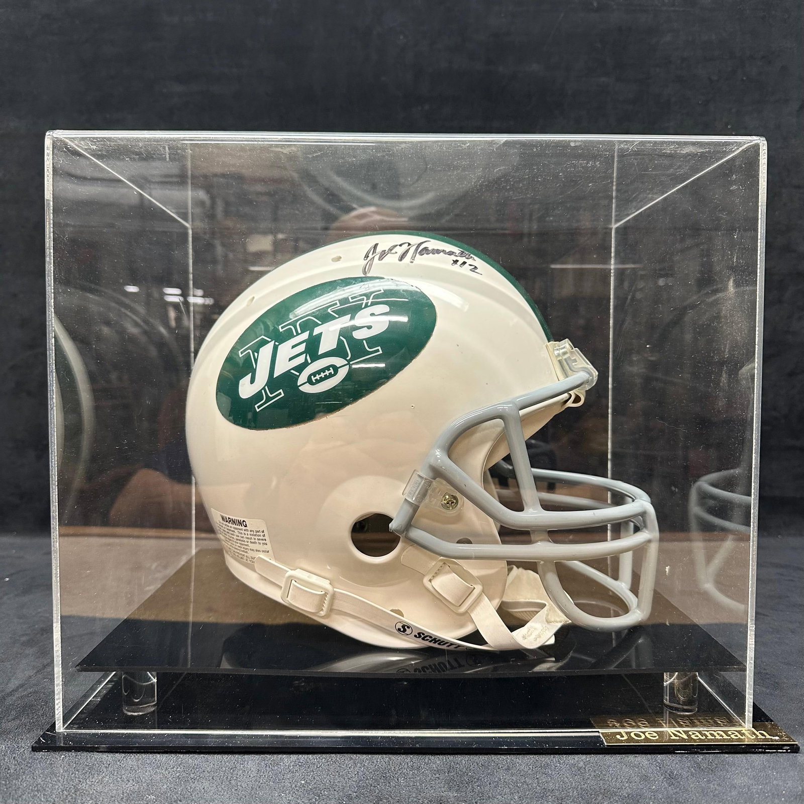 Joe Namath Autographed New York Jets Full-Size Football Helmet in Display Case No COA: Autographed full-size New York Jets football helmet signed by NFL Hall of Famer, former Jets Quarterback. Joe Namath. Signature is applied in black marker on the helmet shell and includes the inscript